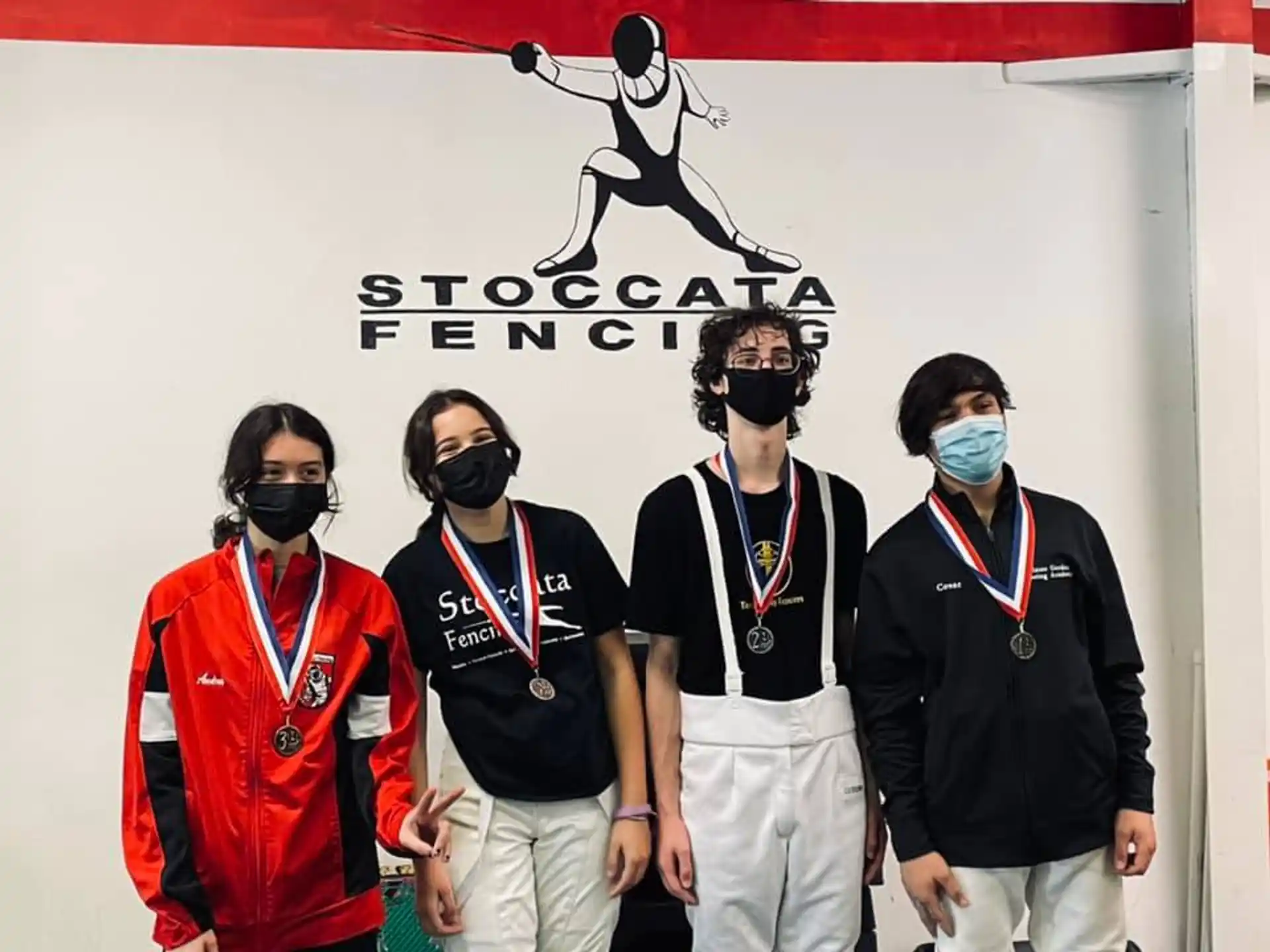 a group of people wearing masks