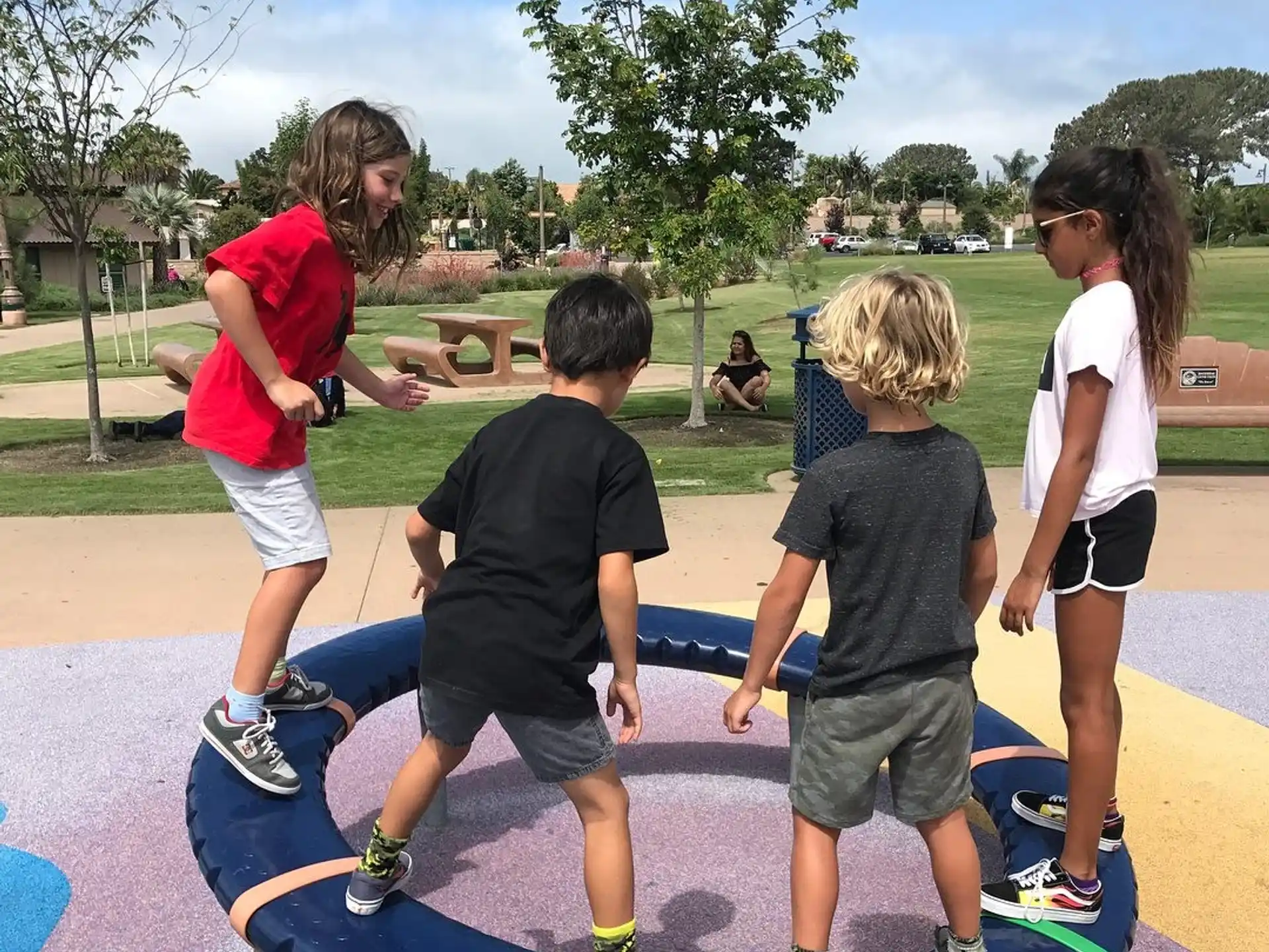a group of kids playing on a trampoline