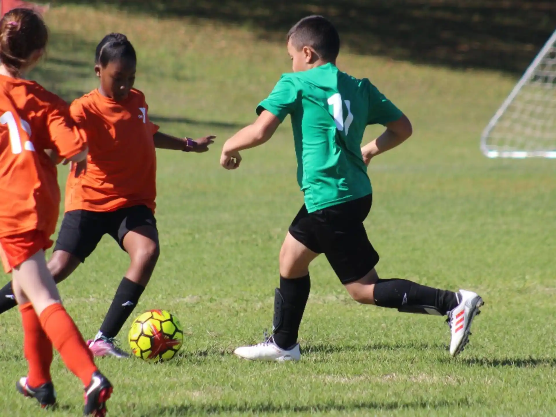 a group of kids playing football