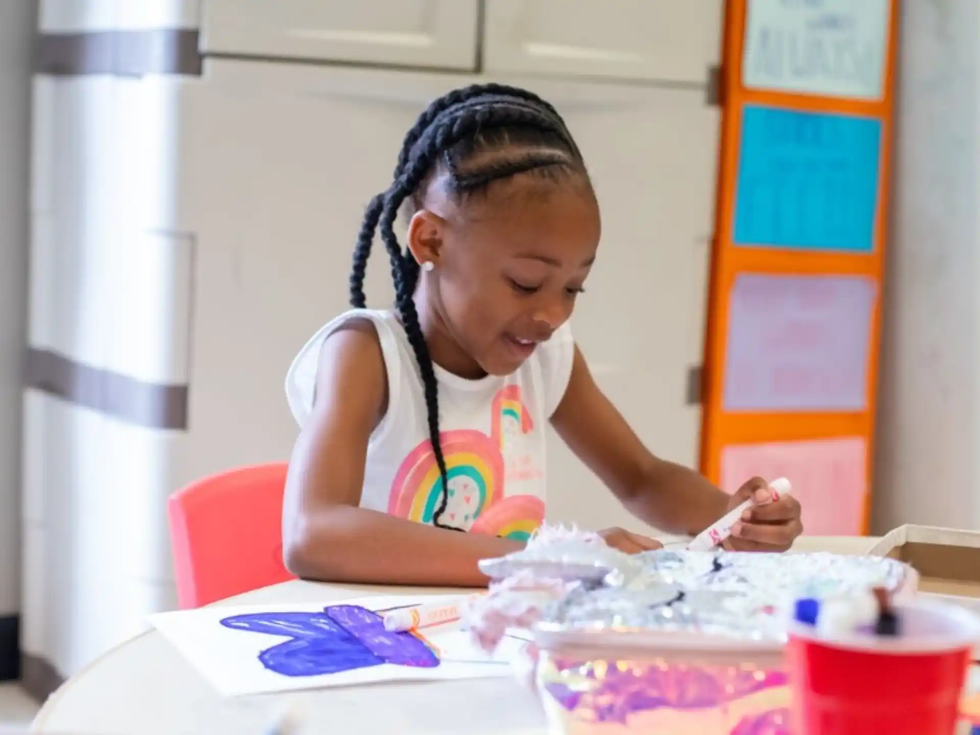 a young girl painting