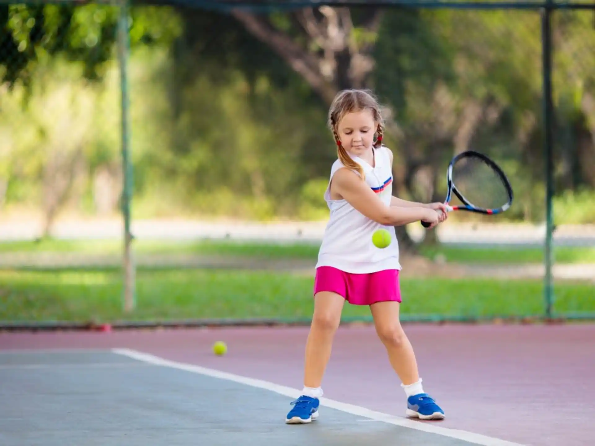 a girl playing tennis
