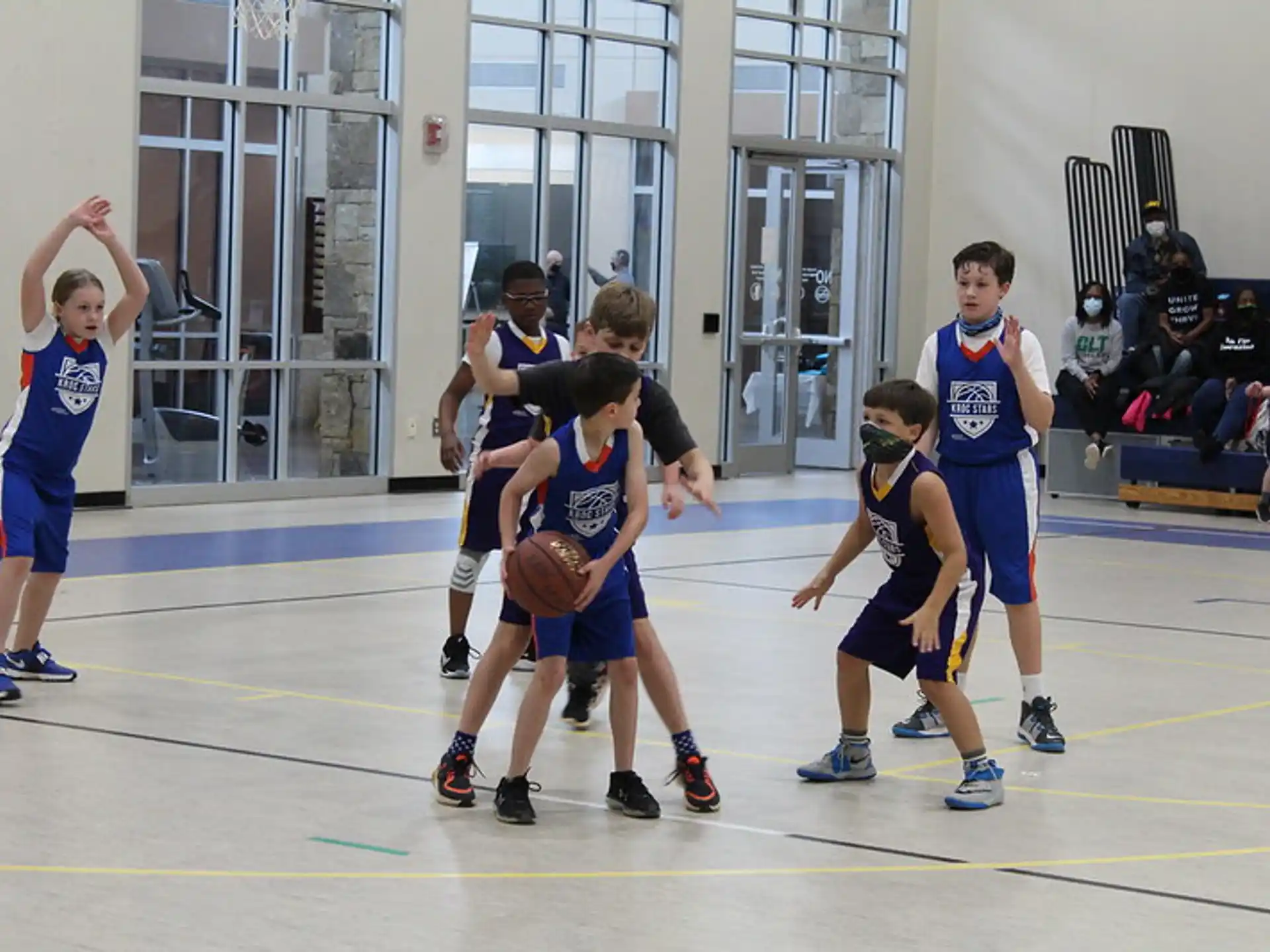 a group of men playing basketball
