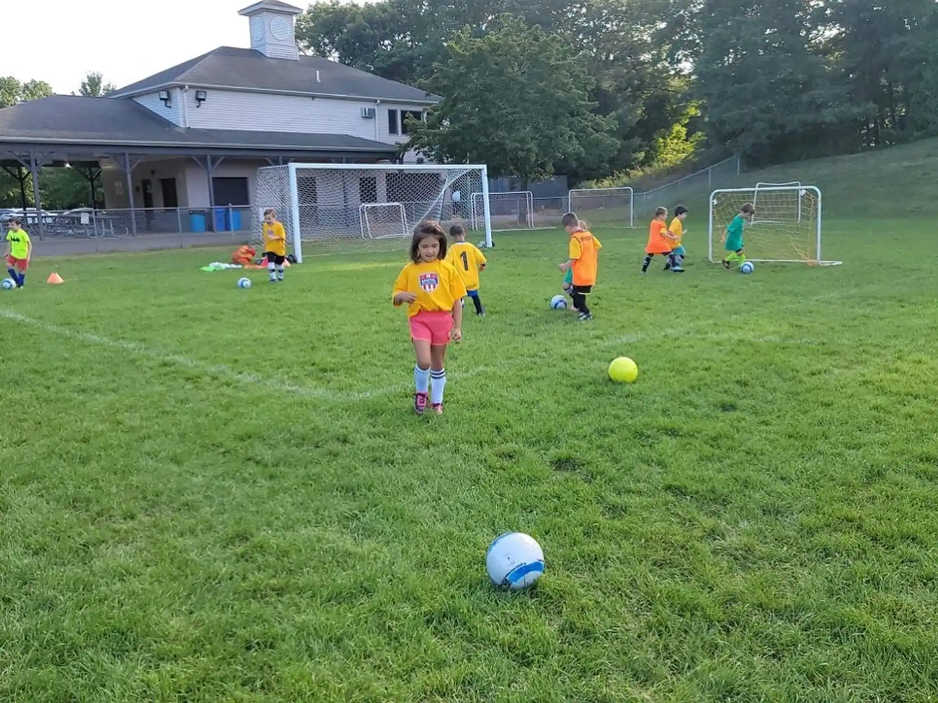 kids playing football on a field