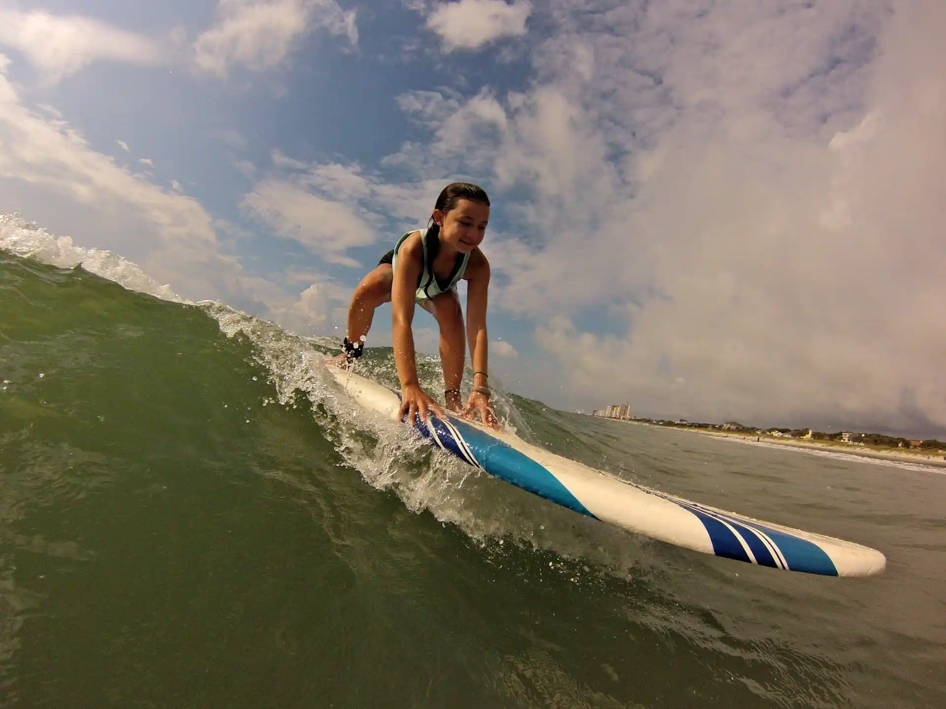 a man riding a surfboard