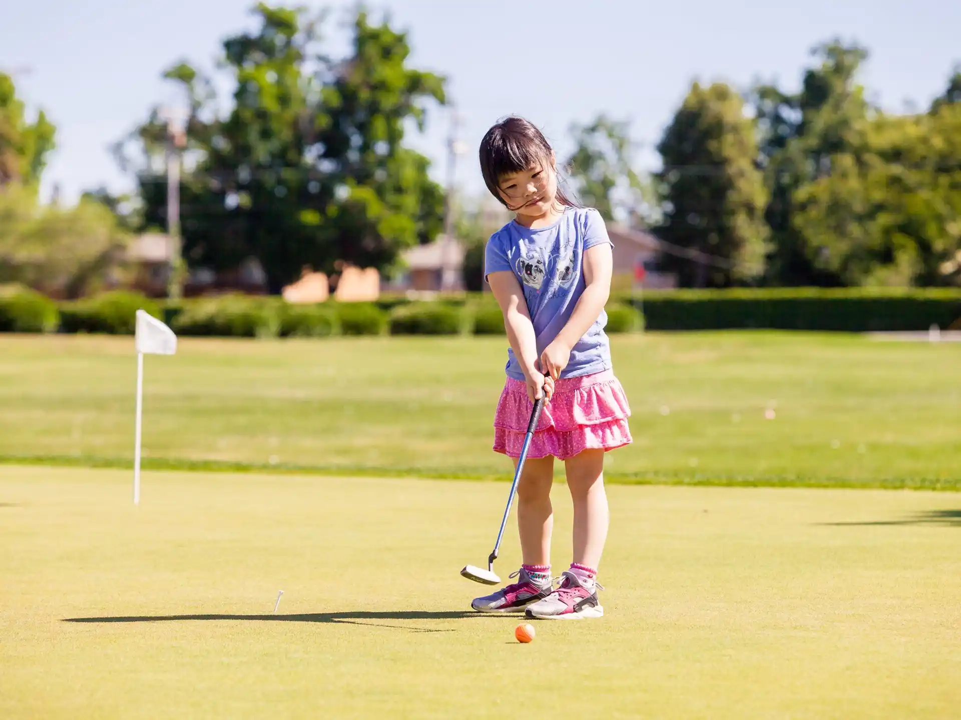 a girl playing golf