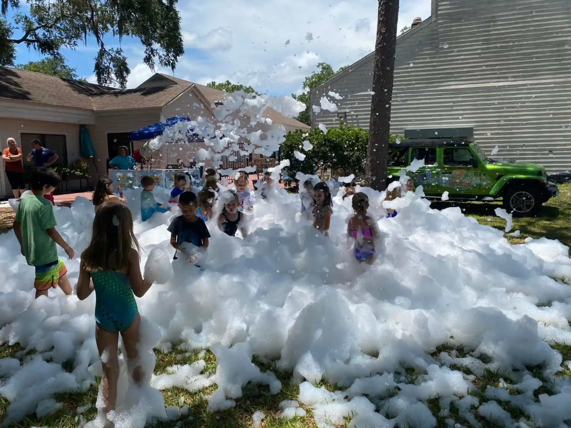 a group of people playing in a water fountain