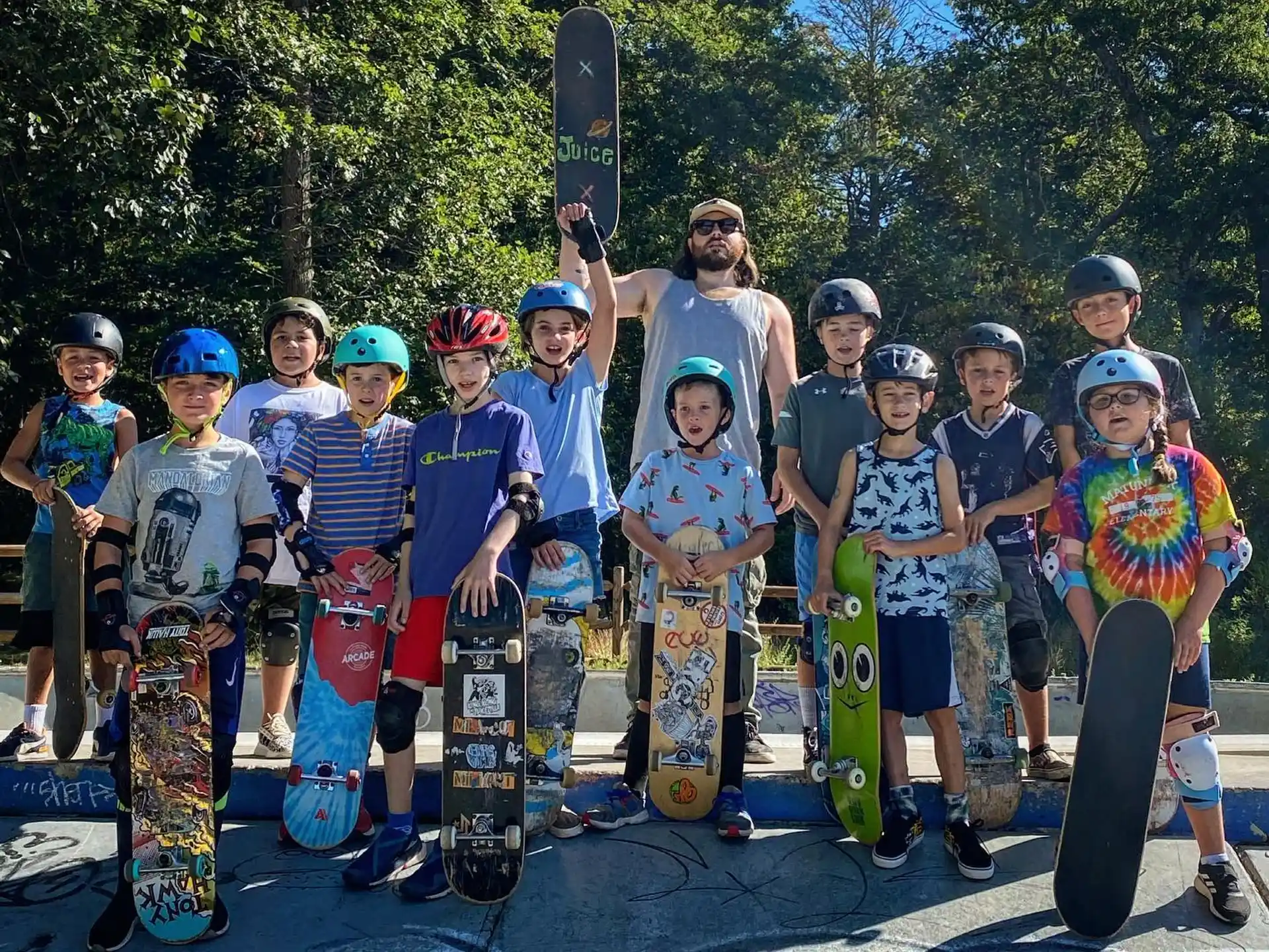 a group of kids holding skateboards