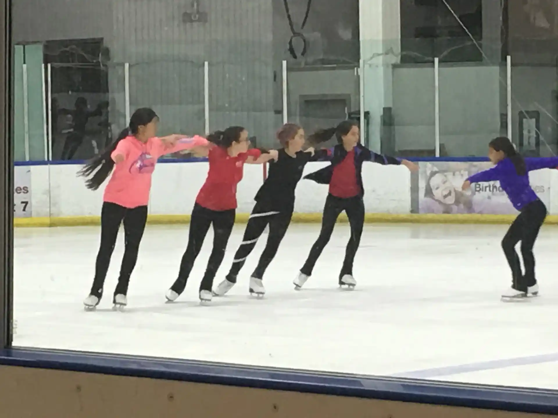 a group of people ice skating