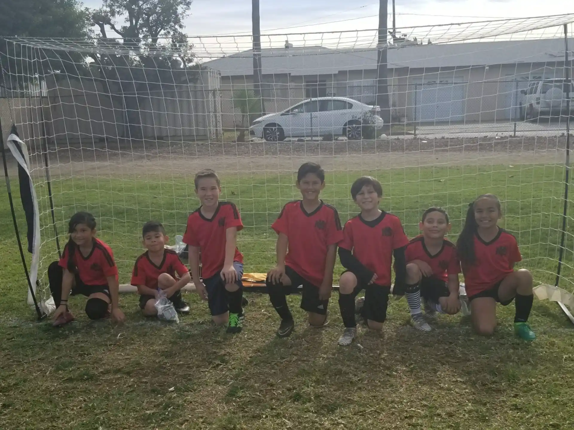 a group of kids posing for a picture