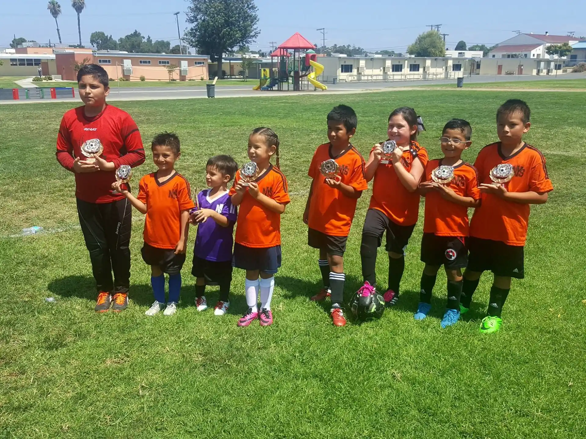 a group of kids posing for a picture