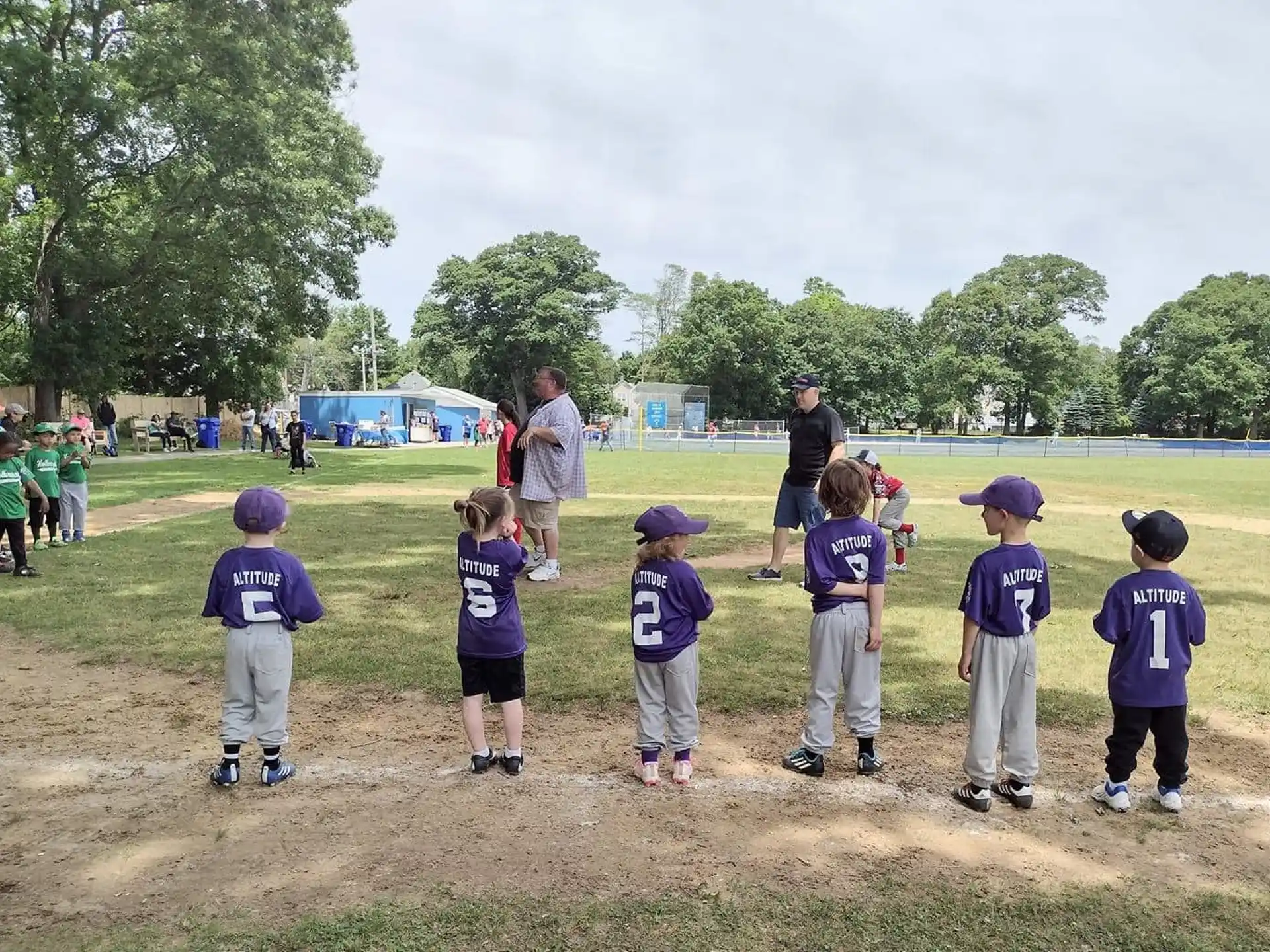 a group of kids in a field