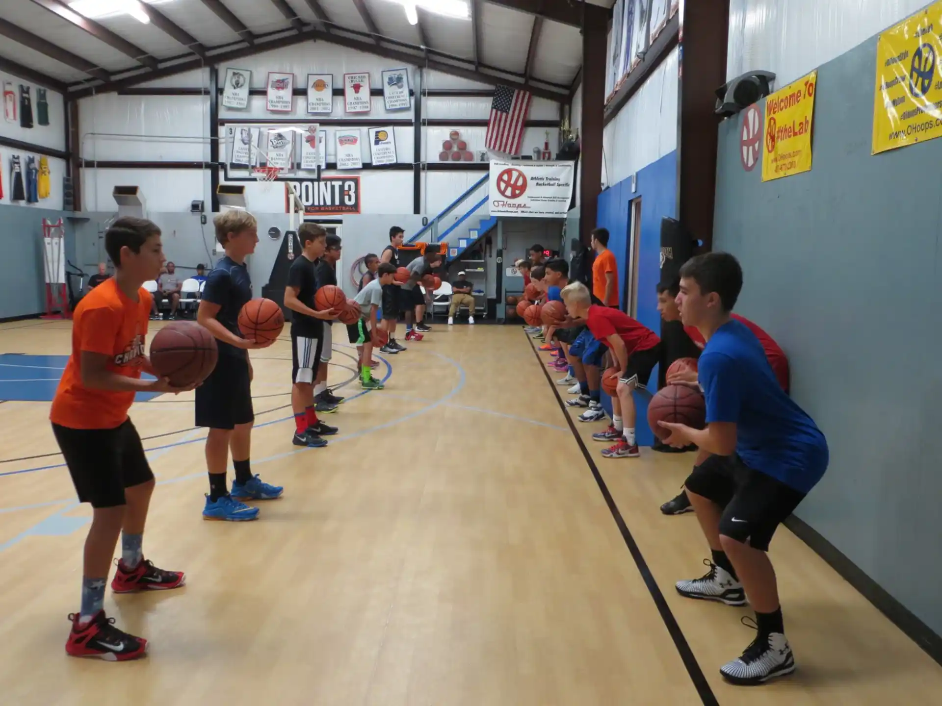 a group of kids playing basketball