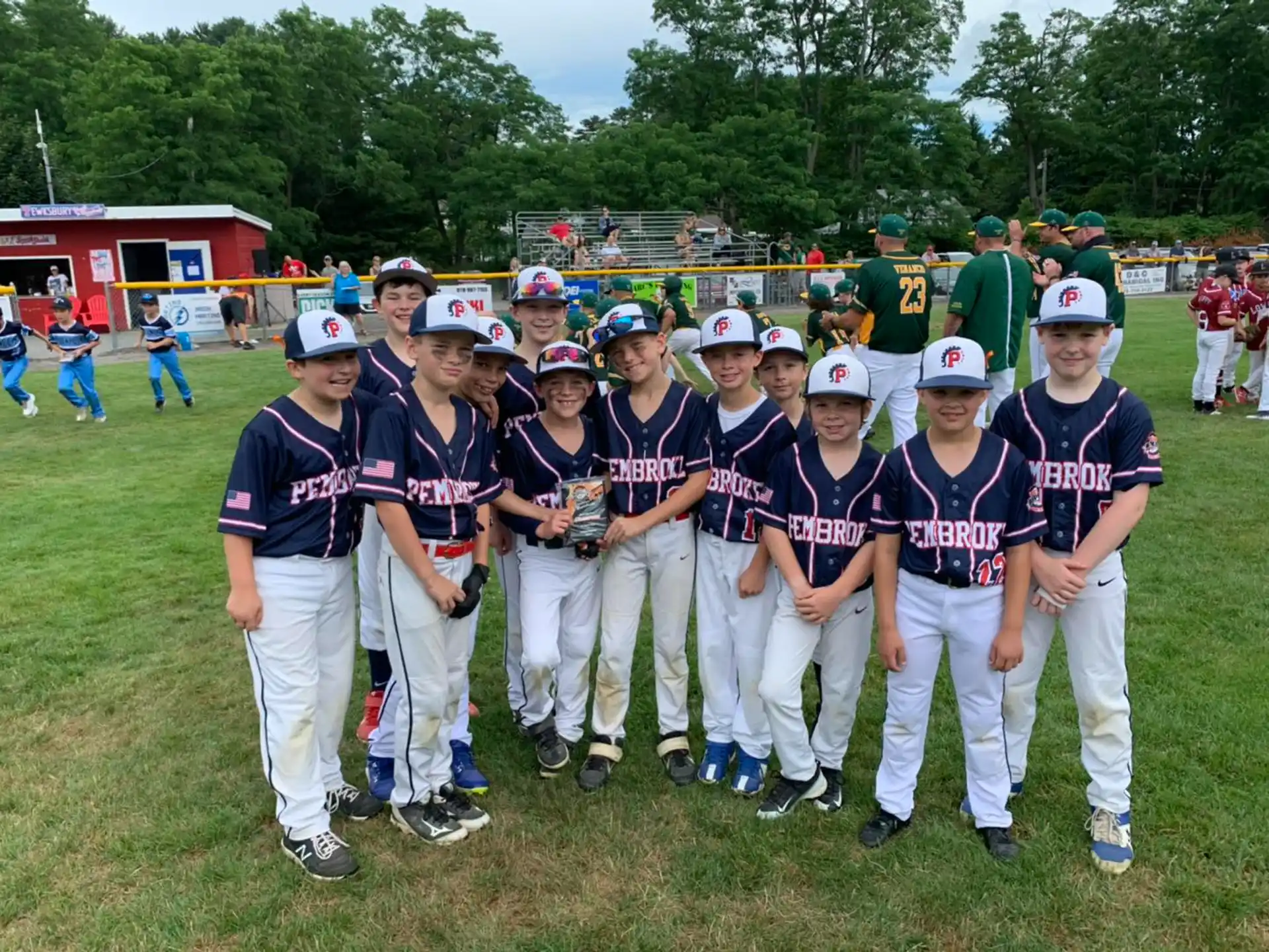 a group of kids wearing baseball uniforms