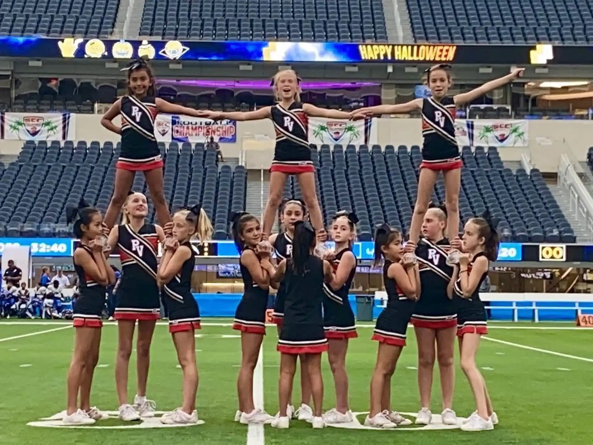 a group of cheerleaders on a field