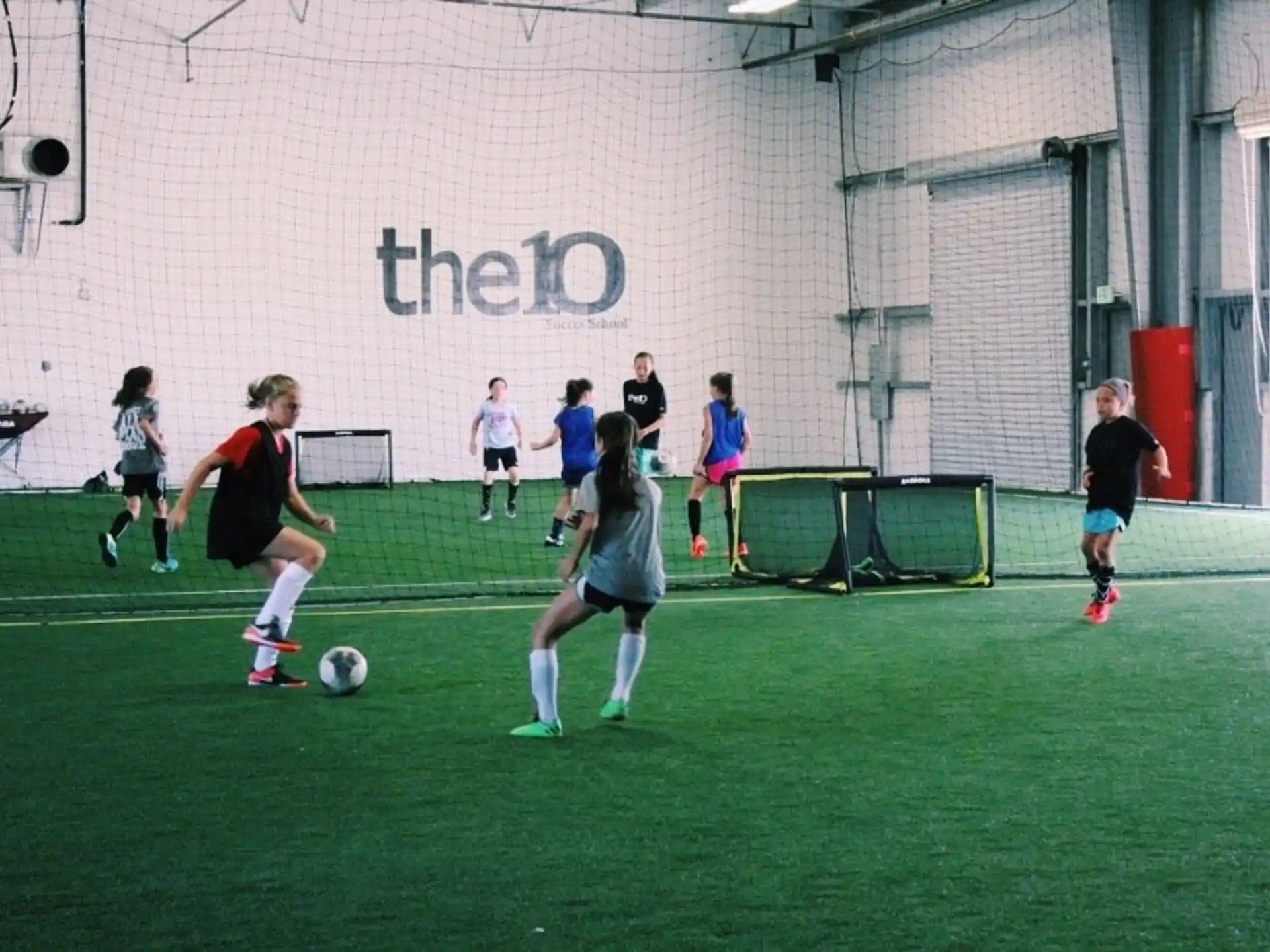 a group of girls playing football