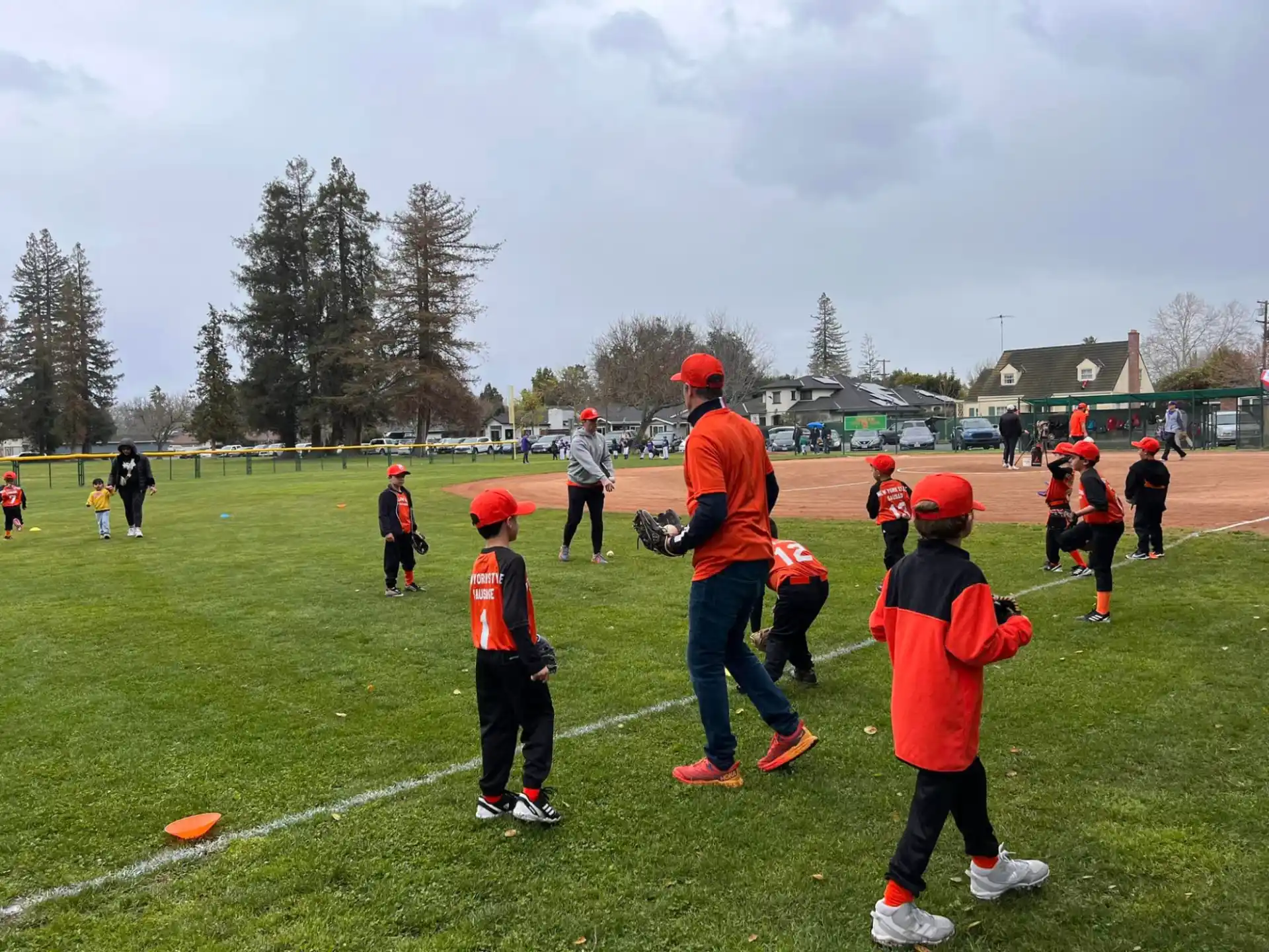 a group of kids playing baseball