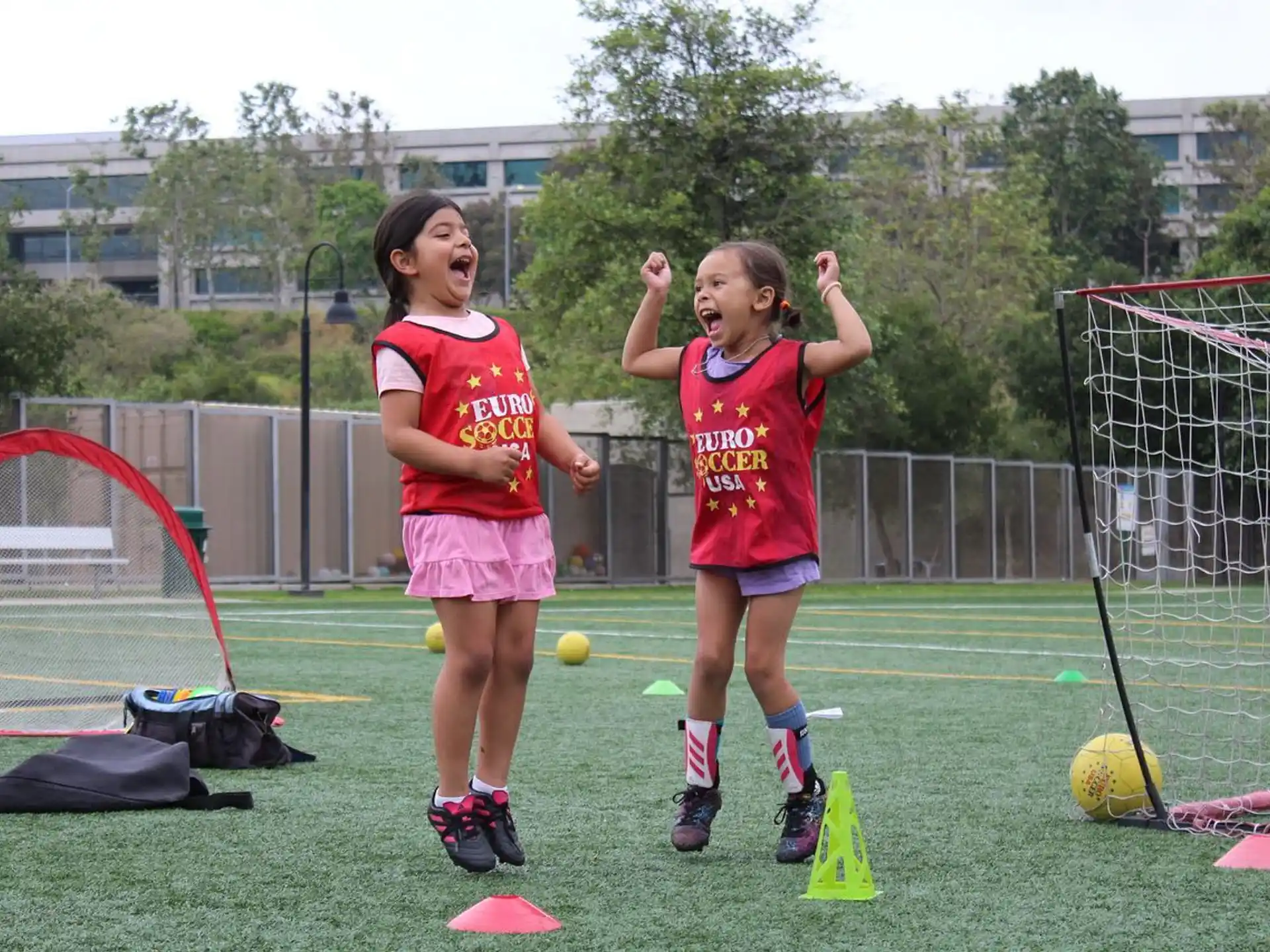 girls playing football on a field