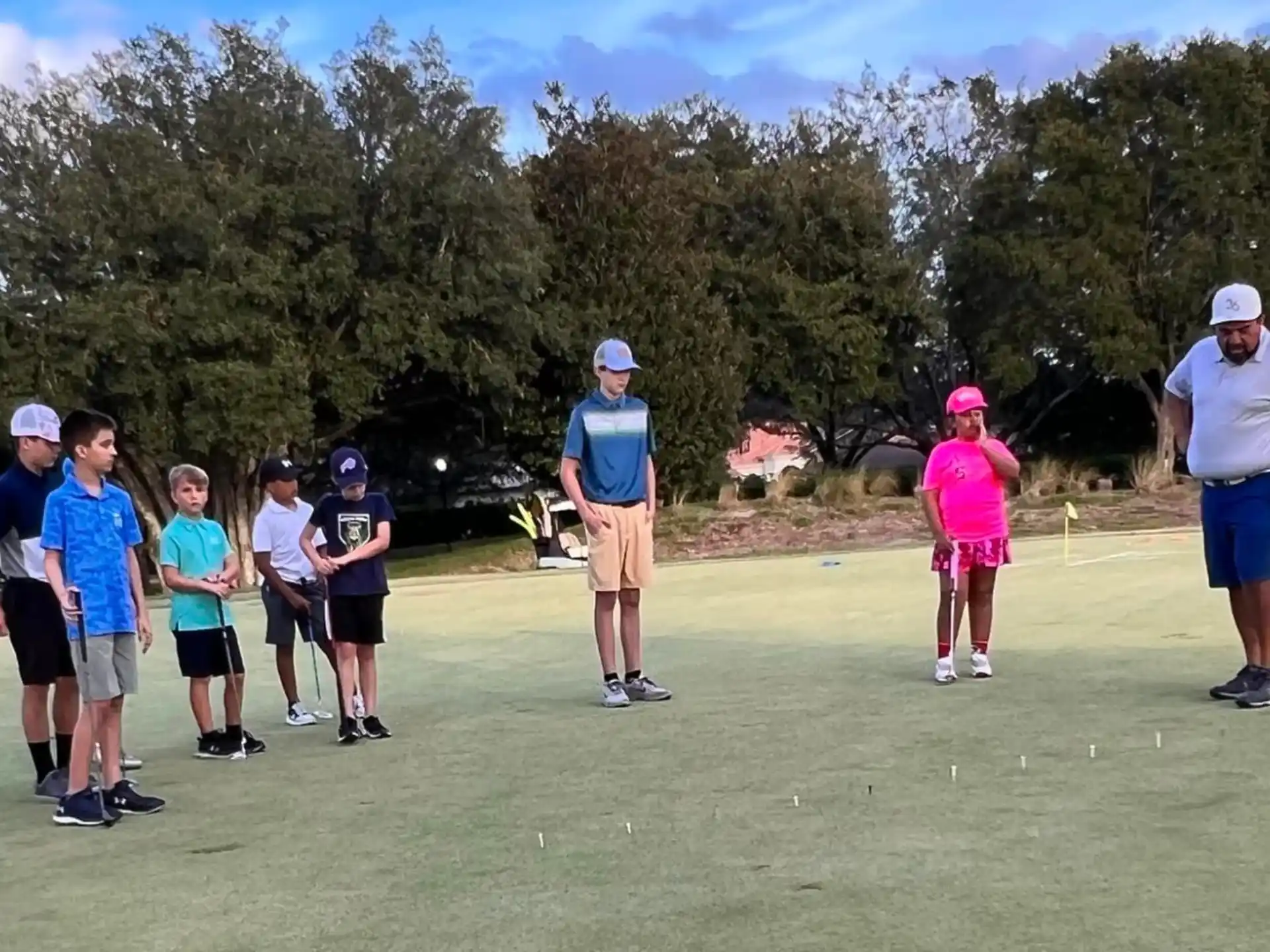 a group of people on a golf course