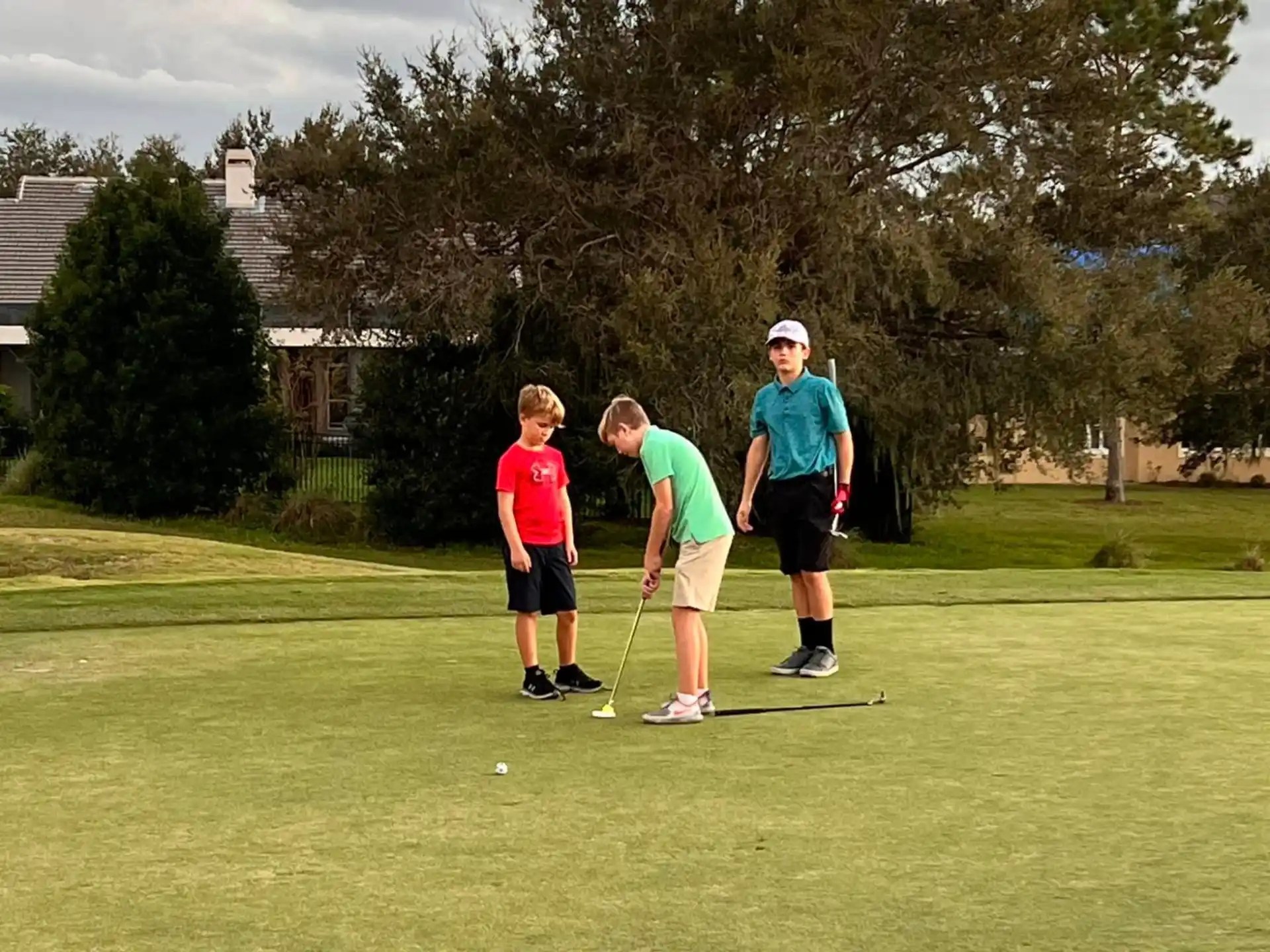 a group of people playing golf