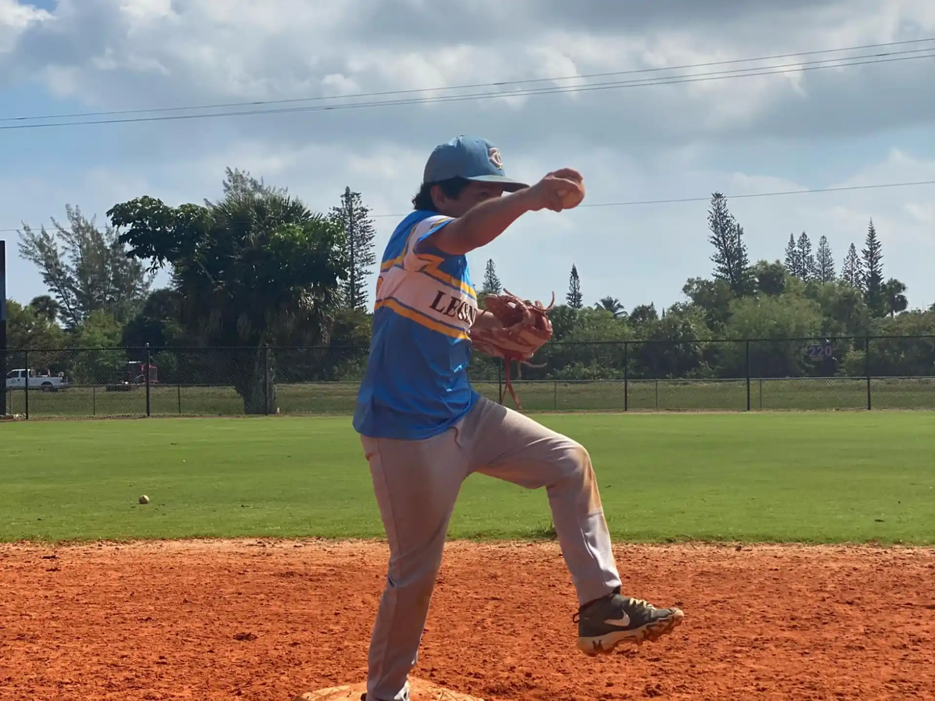 a baseball player throwing a ball