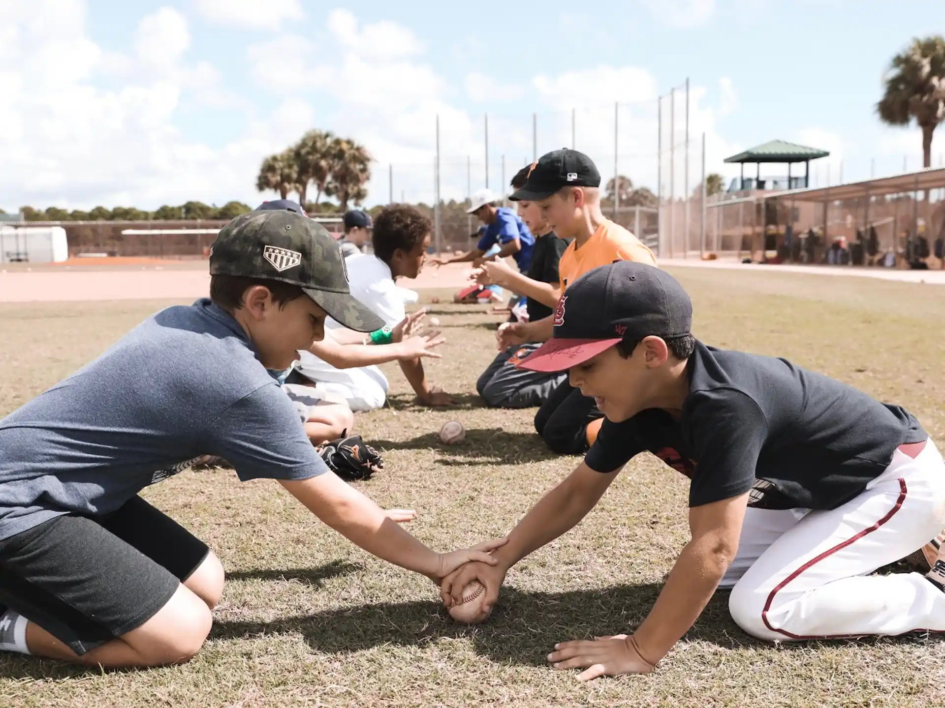 a group of people kneeling on the ground