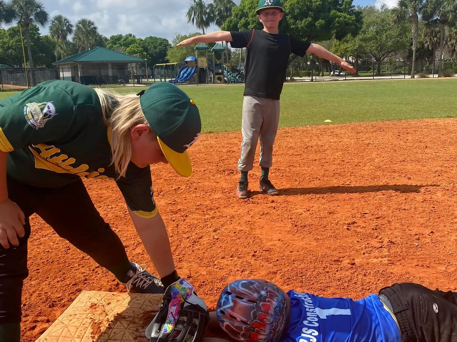 a woman and a man on a baseball field