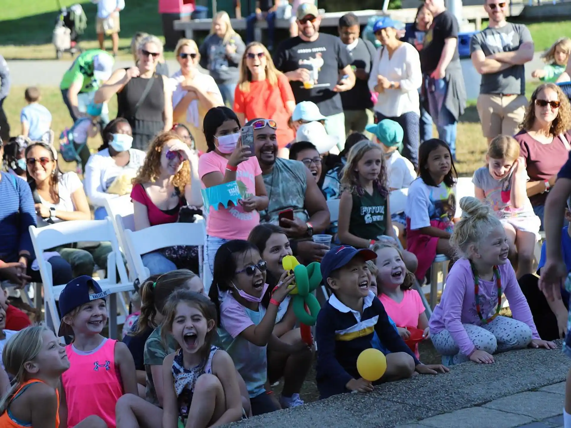 a group of people sitting on the ground