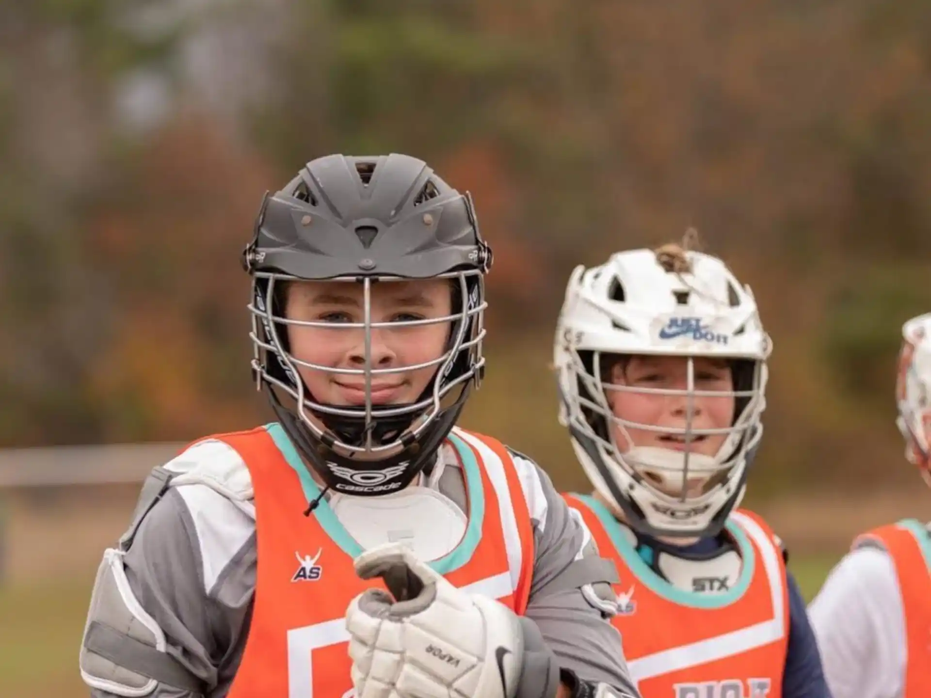 a group of people wearing helmets and holding a baton