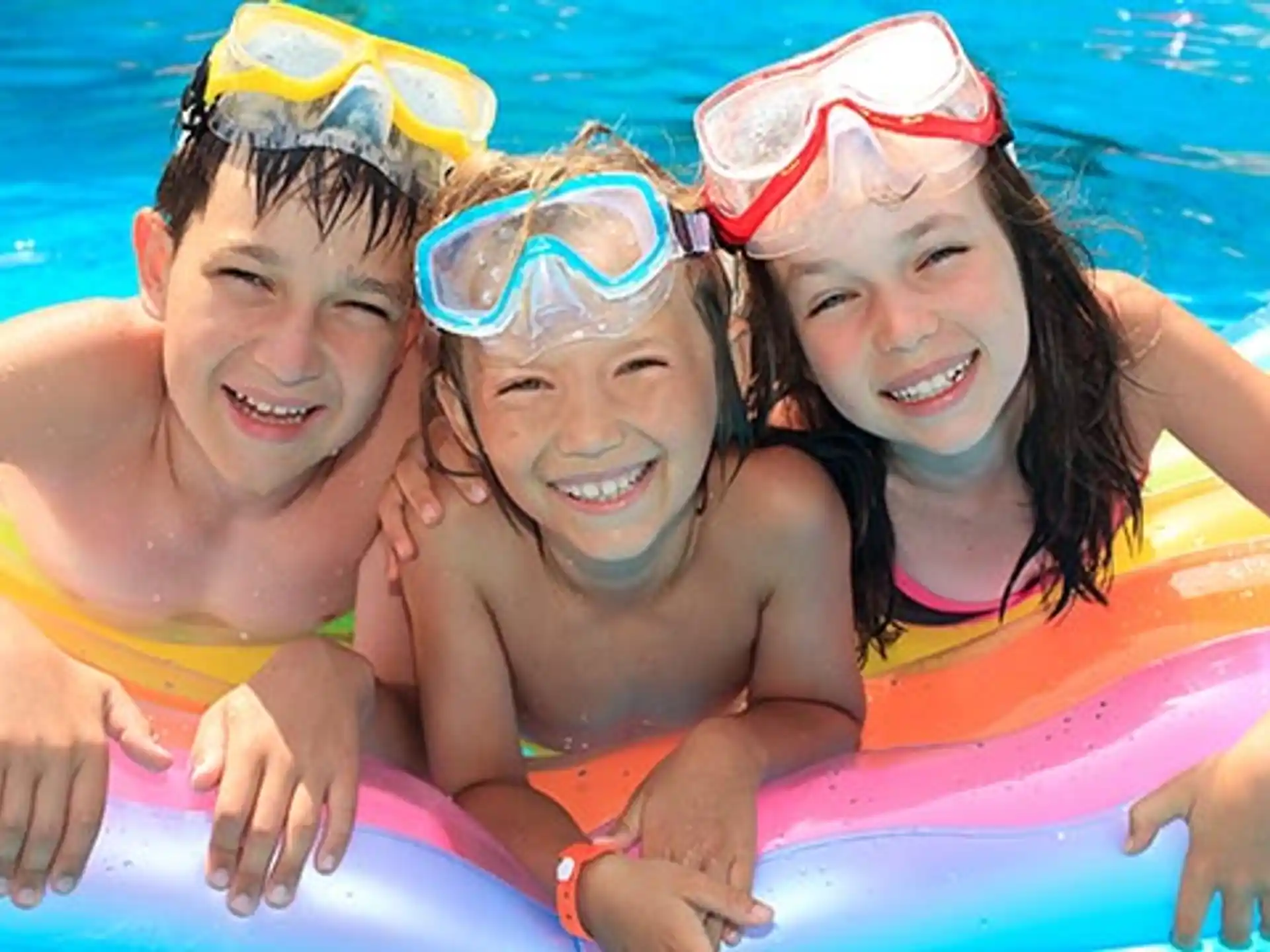 a group of kids in a pool