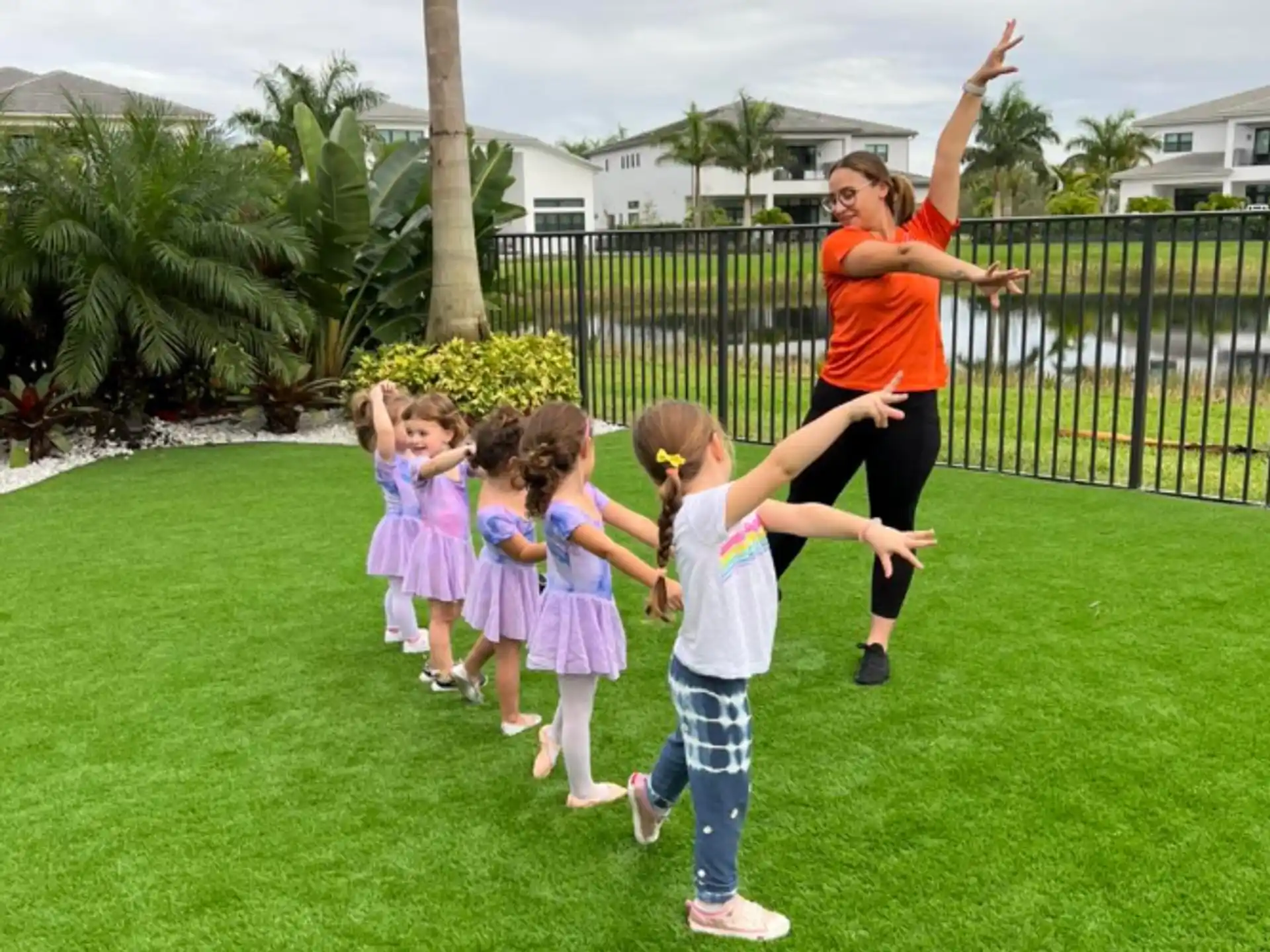 a person and several children jumping in the air