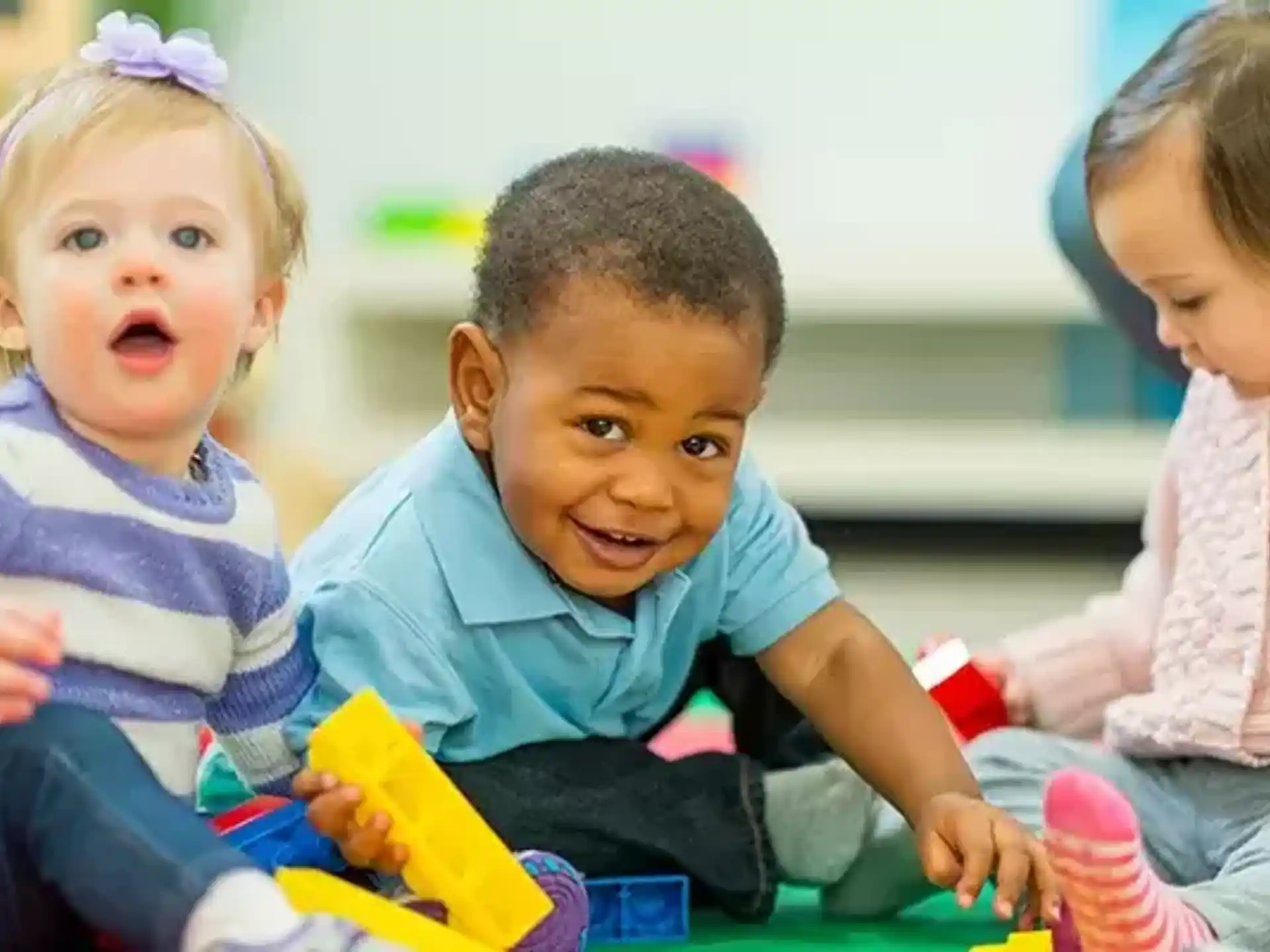 a group of children playing with toys