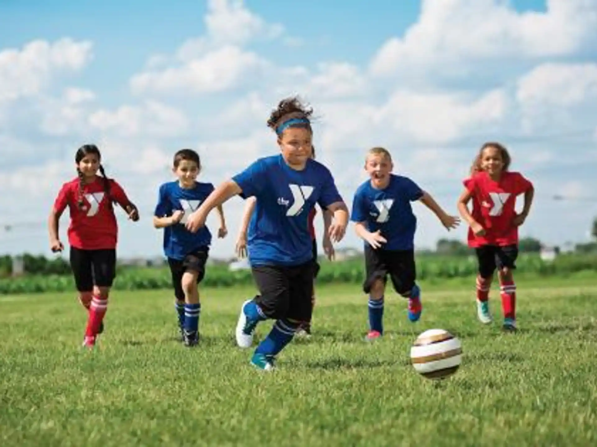 a group of kids playing football