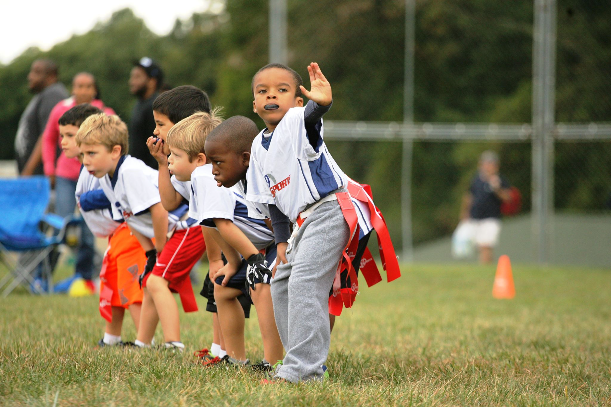 a group of kids playing football