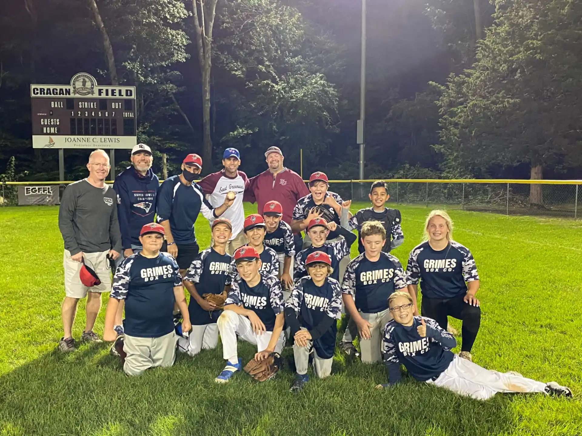 a group of baseball players posing for a photo