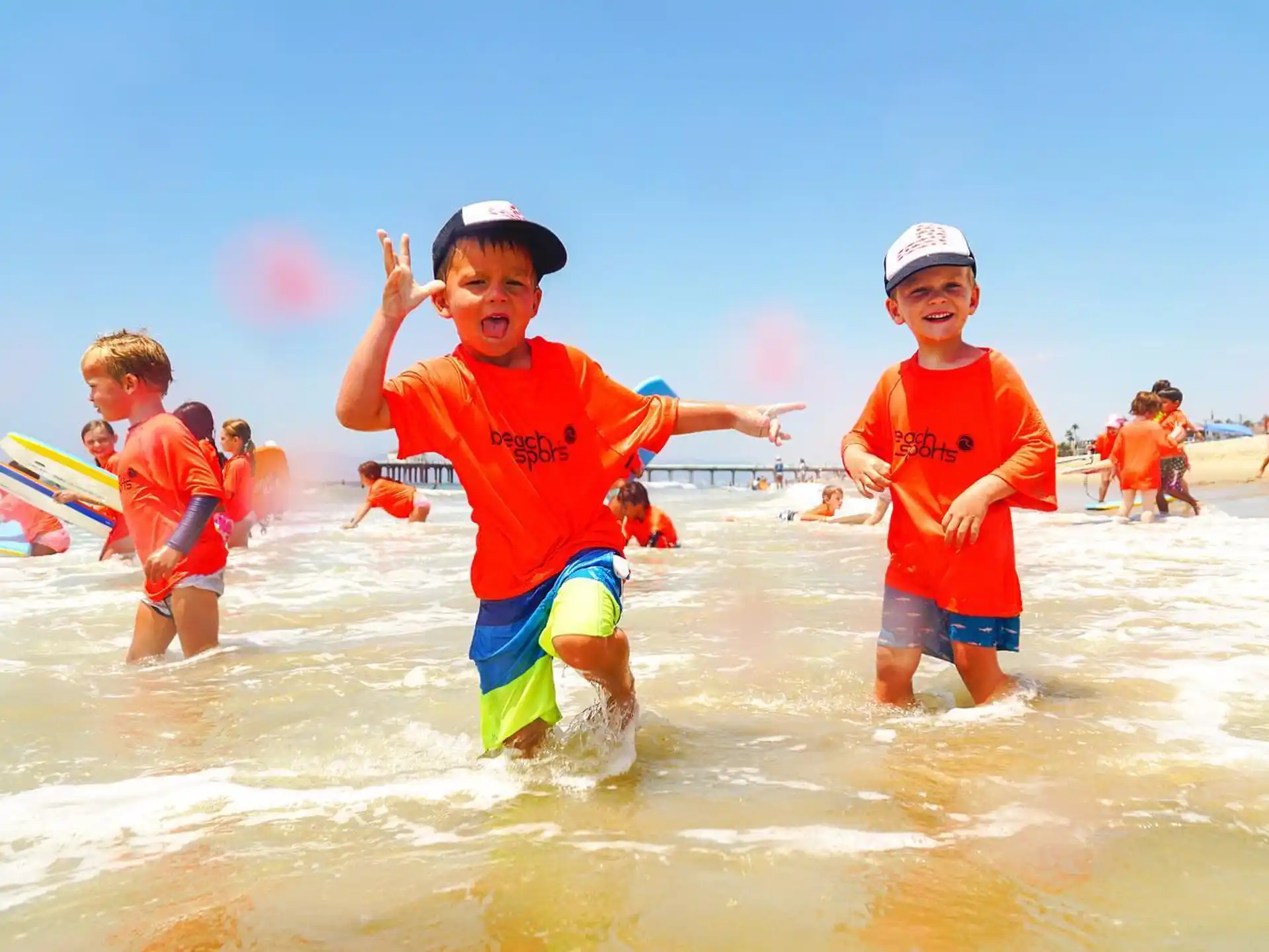 a group of kids playing in the water