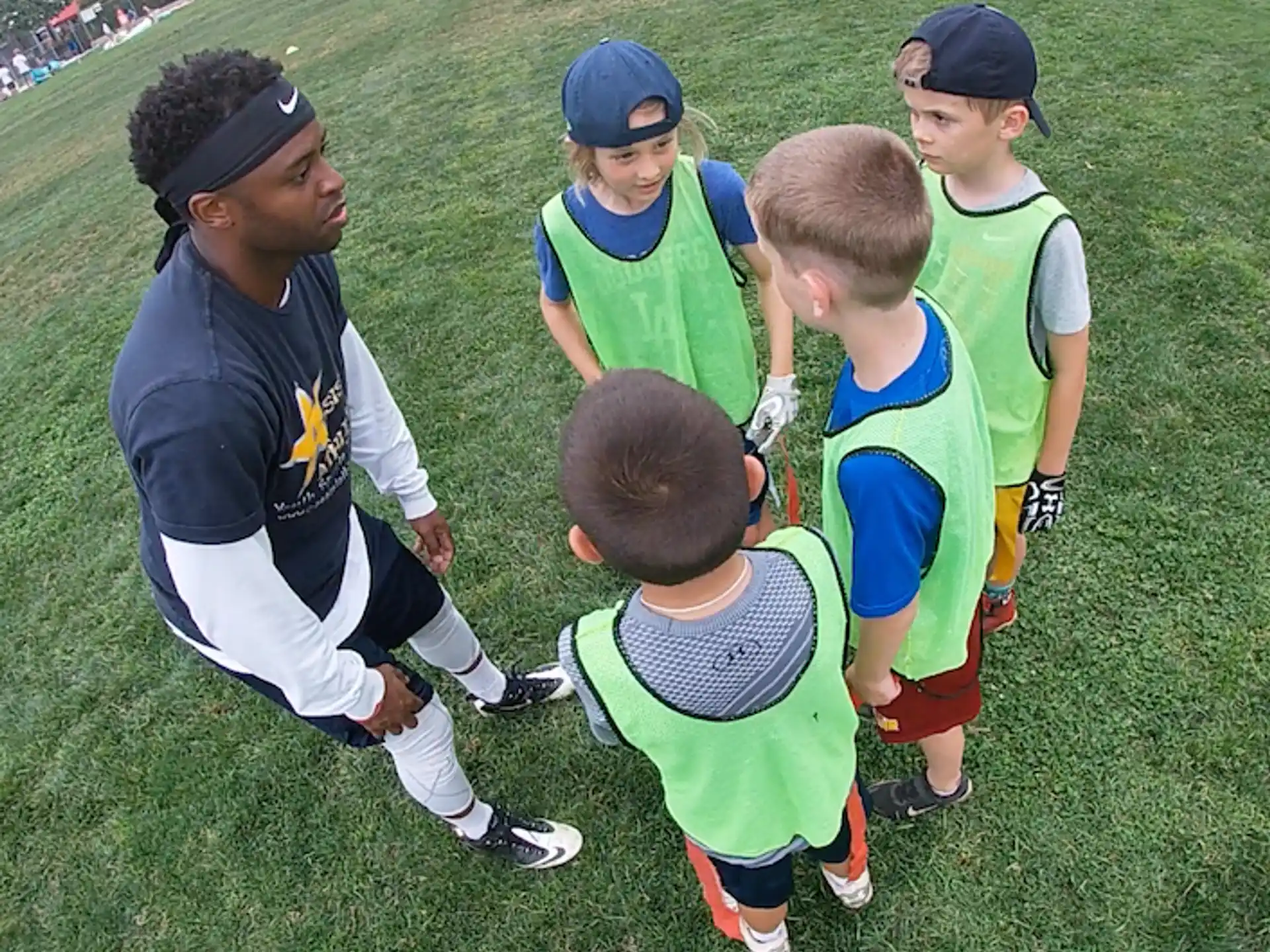 a group of kids in sports uniforms