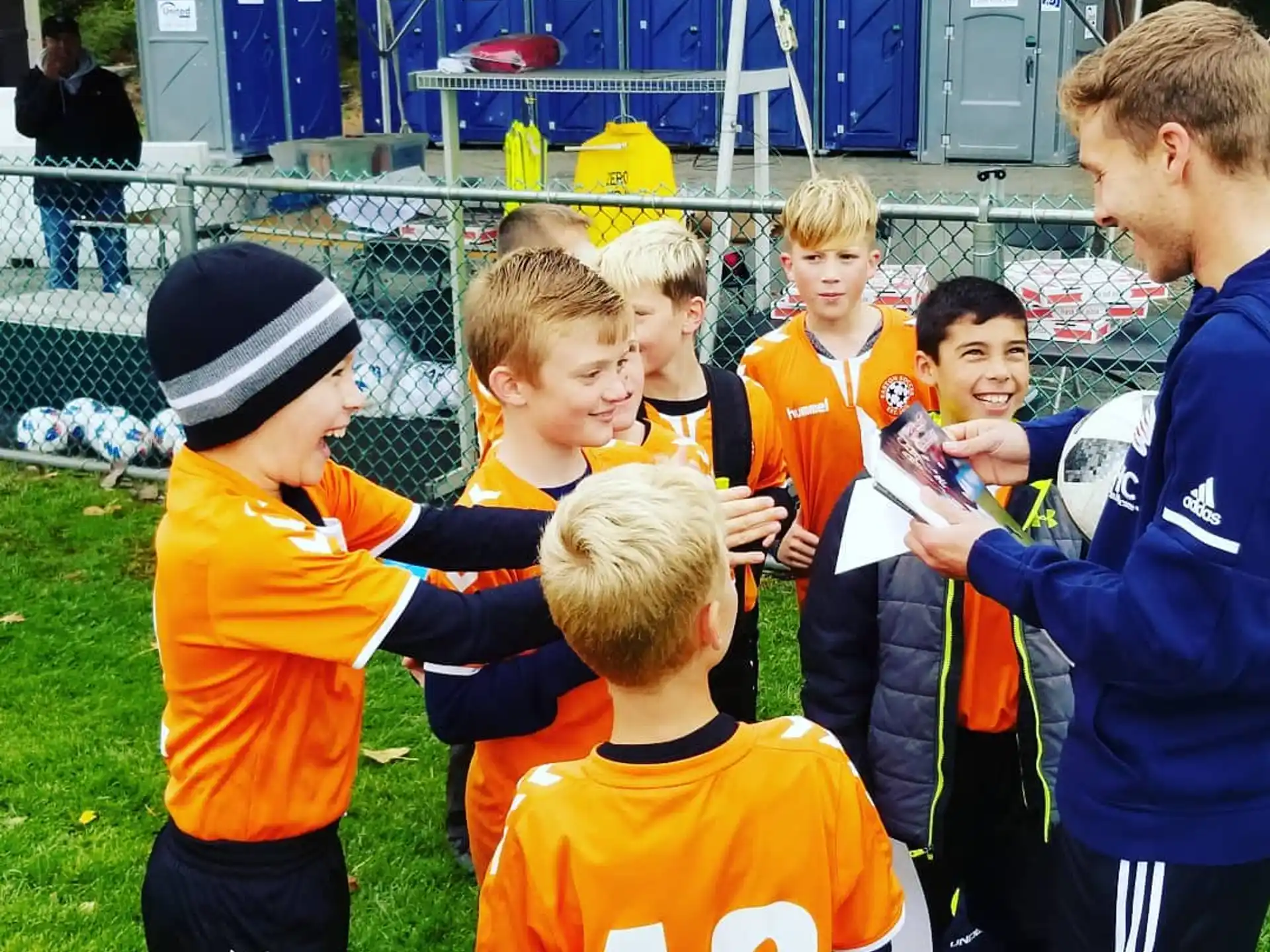 a group of boys in sports uniforms