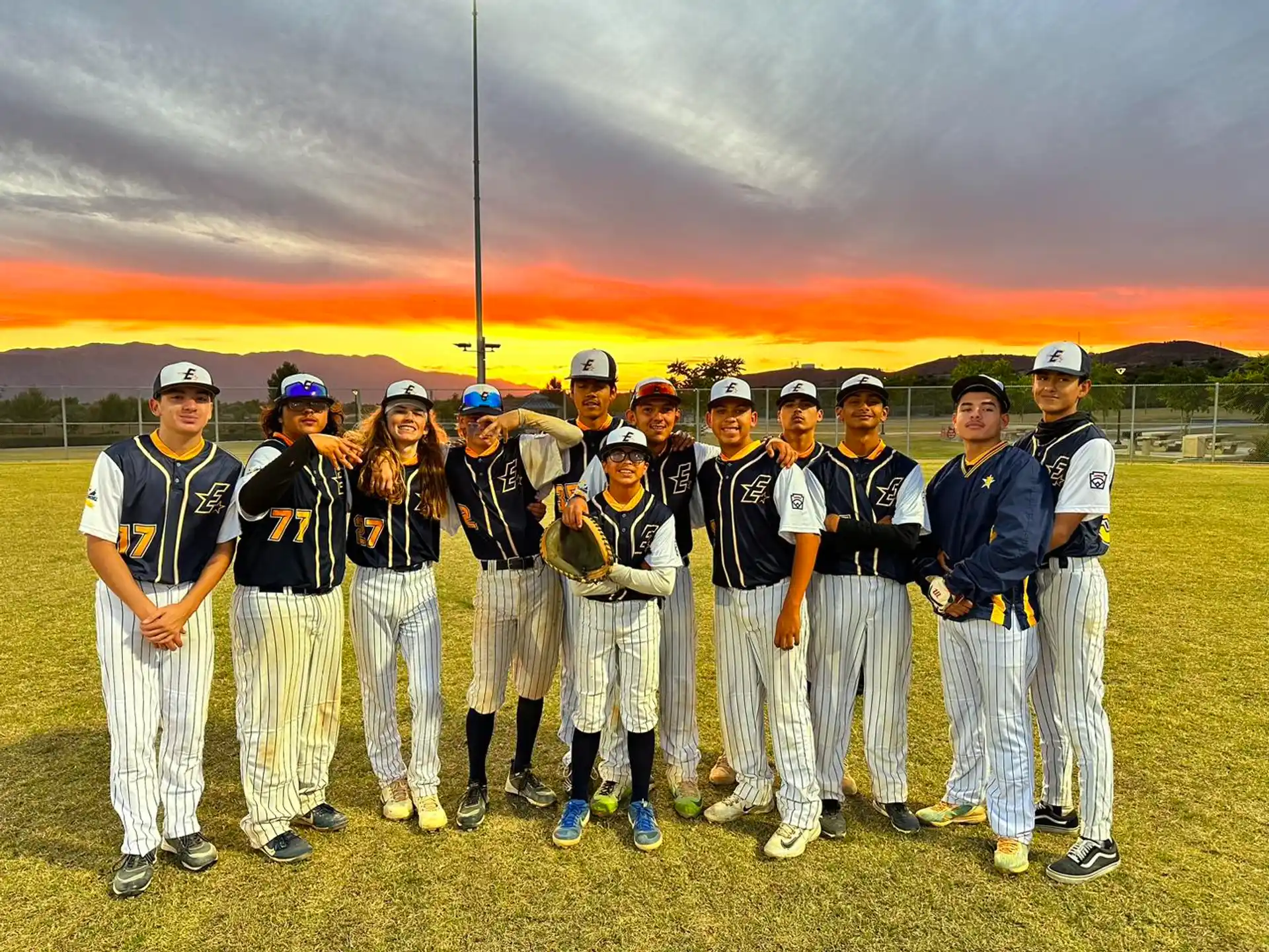 a group of baseball players posing for a photo