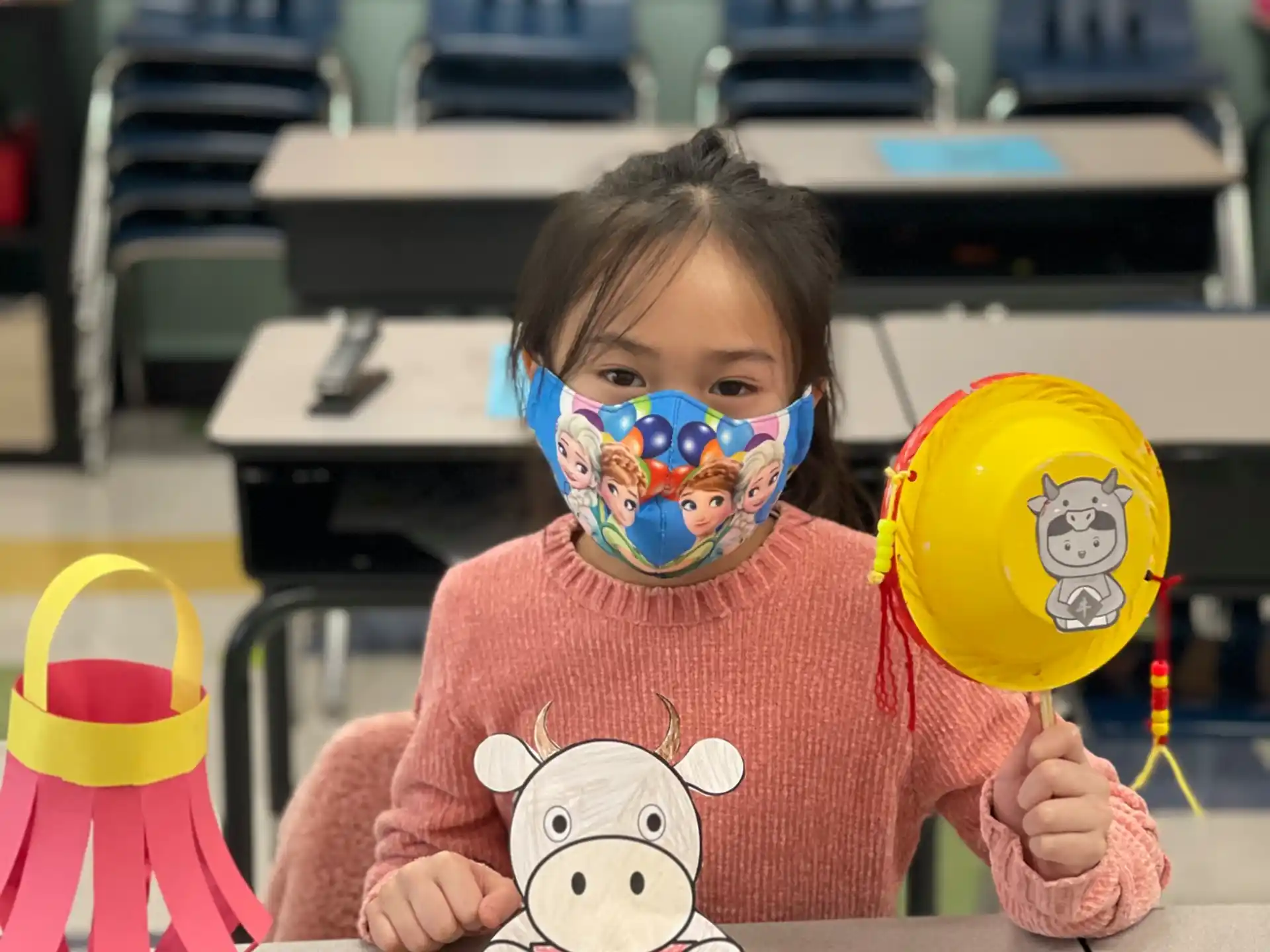 a child holding a toy