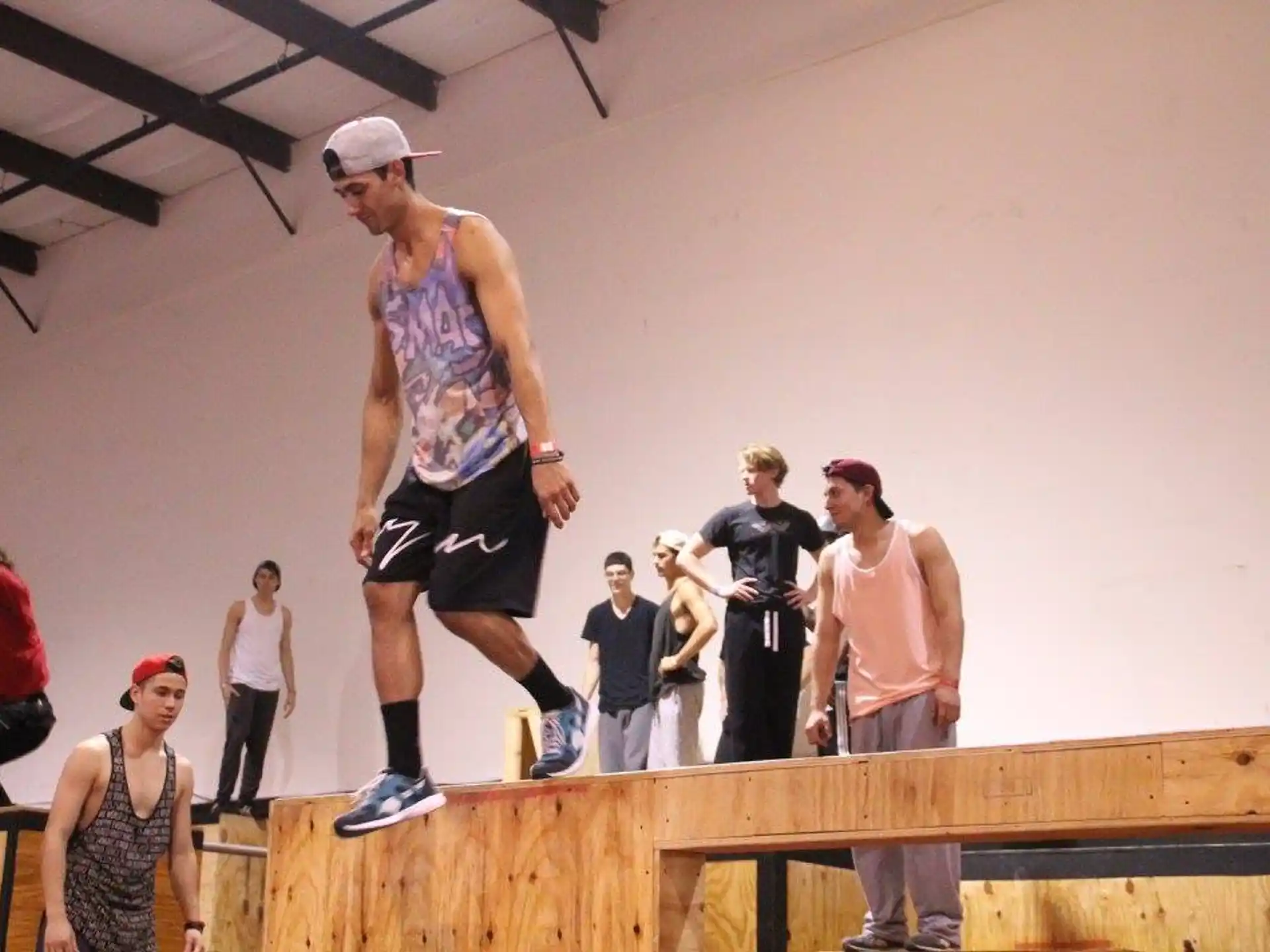 a man standing on a wooden platform