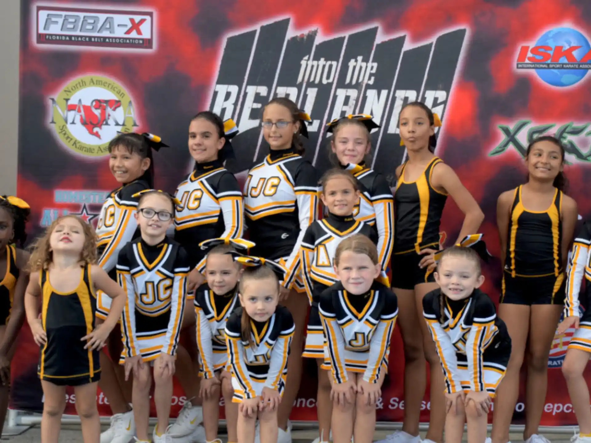 a group of cheerleaders posing for a photo