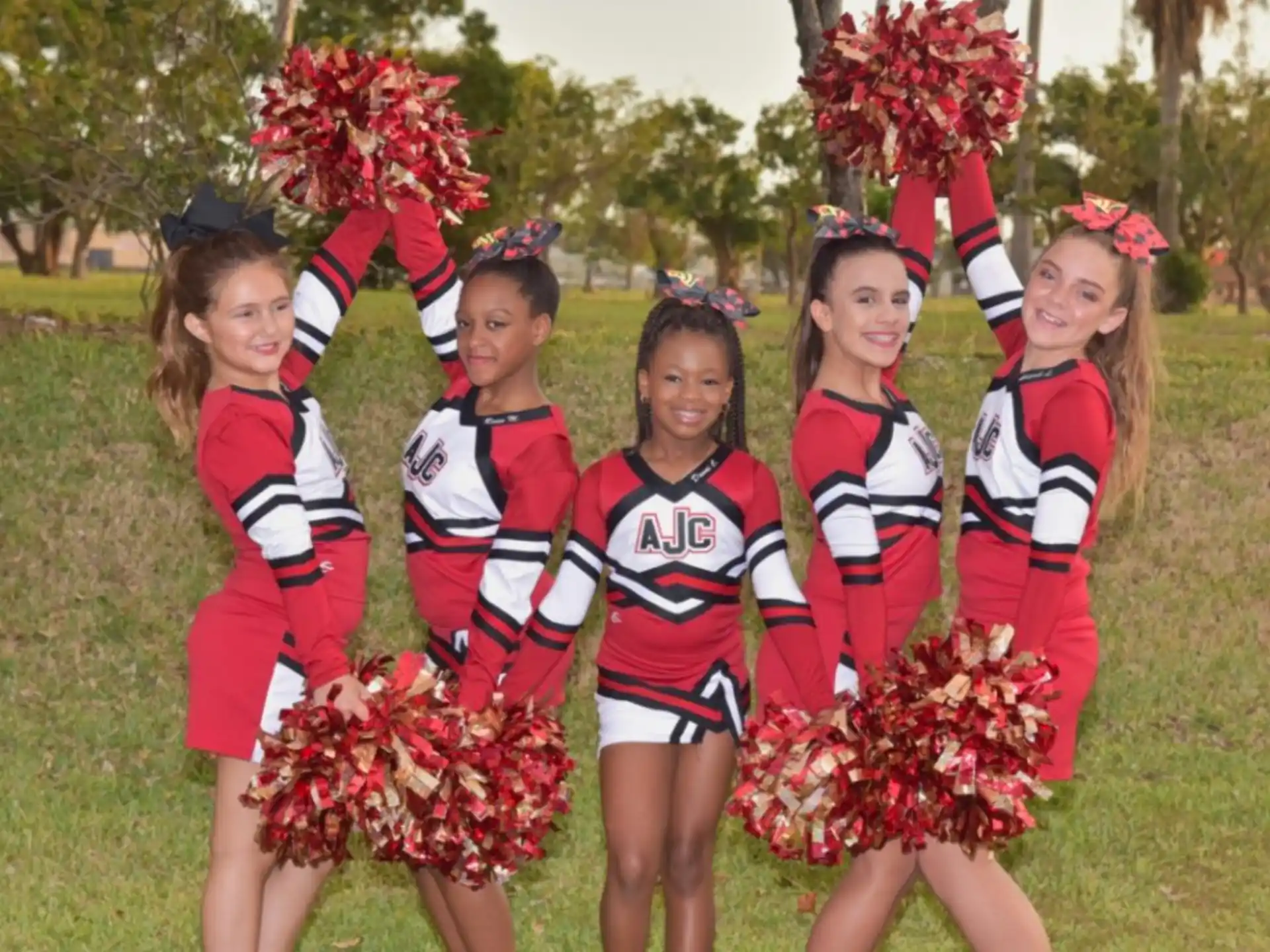 a group of cheerleaders posing for a photo