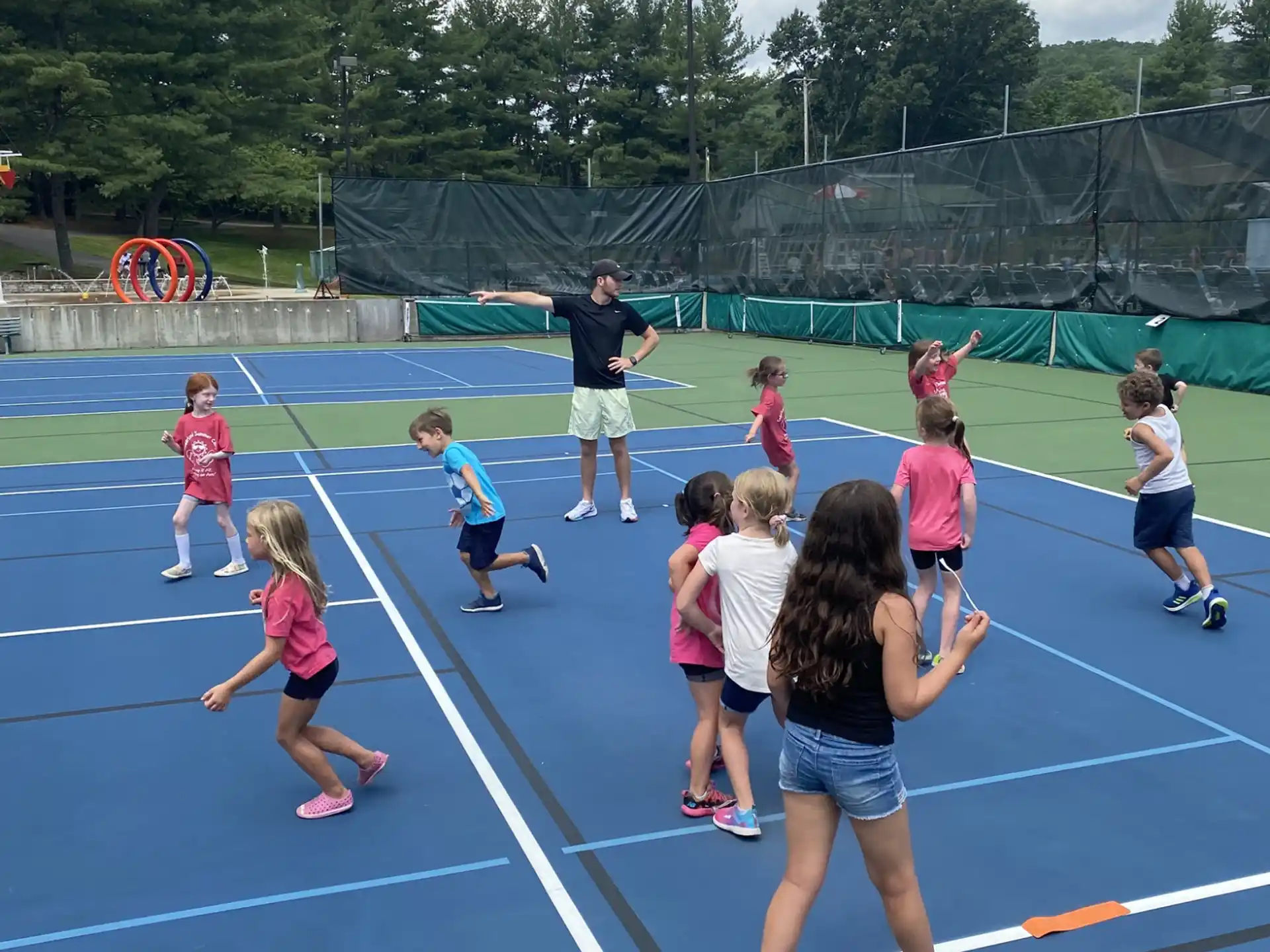 a group of kids playing on a track