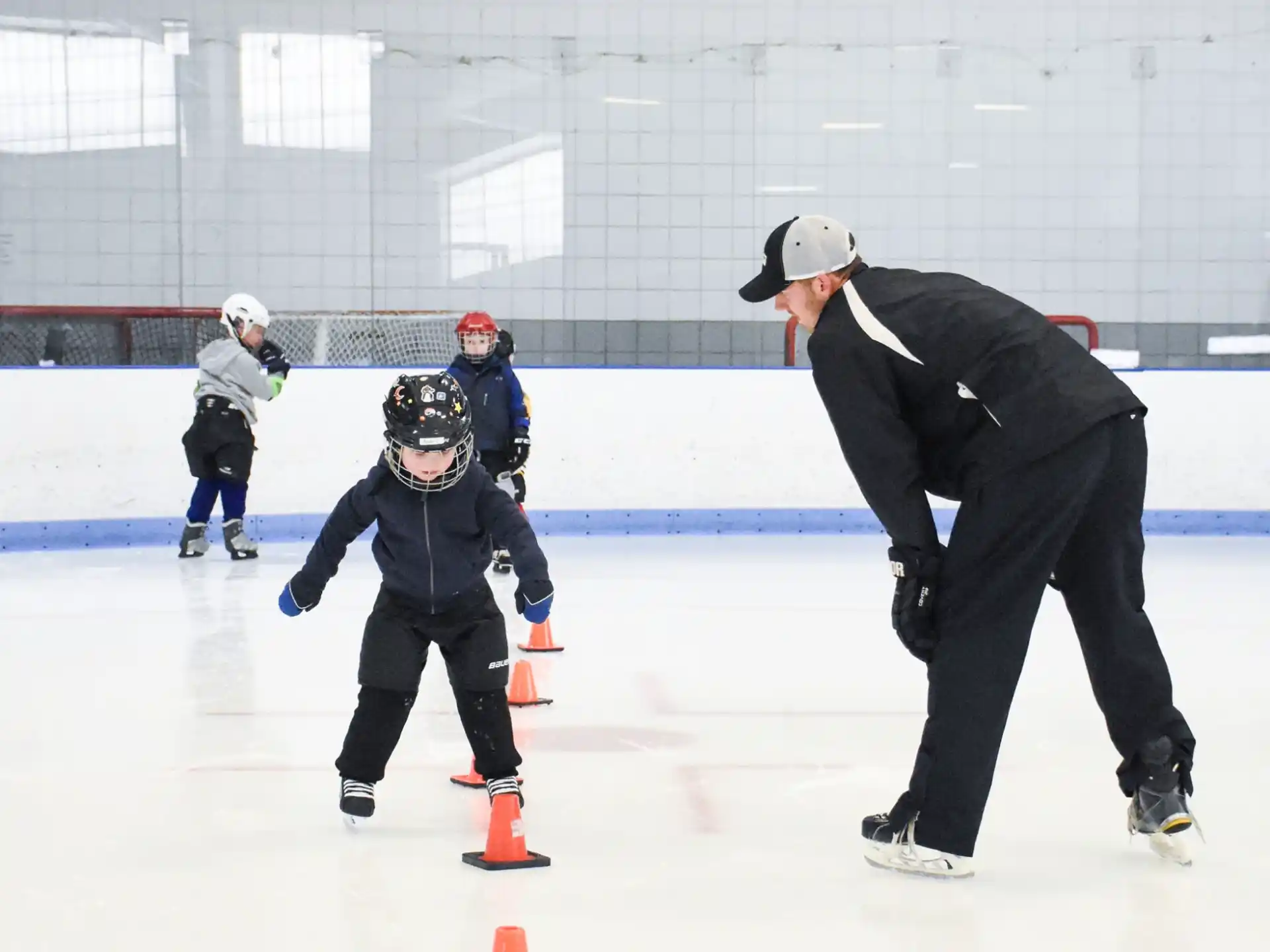 a person and a boy ice skating