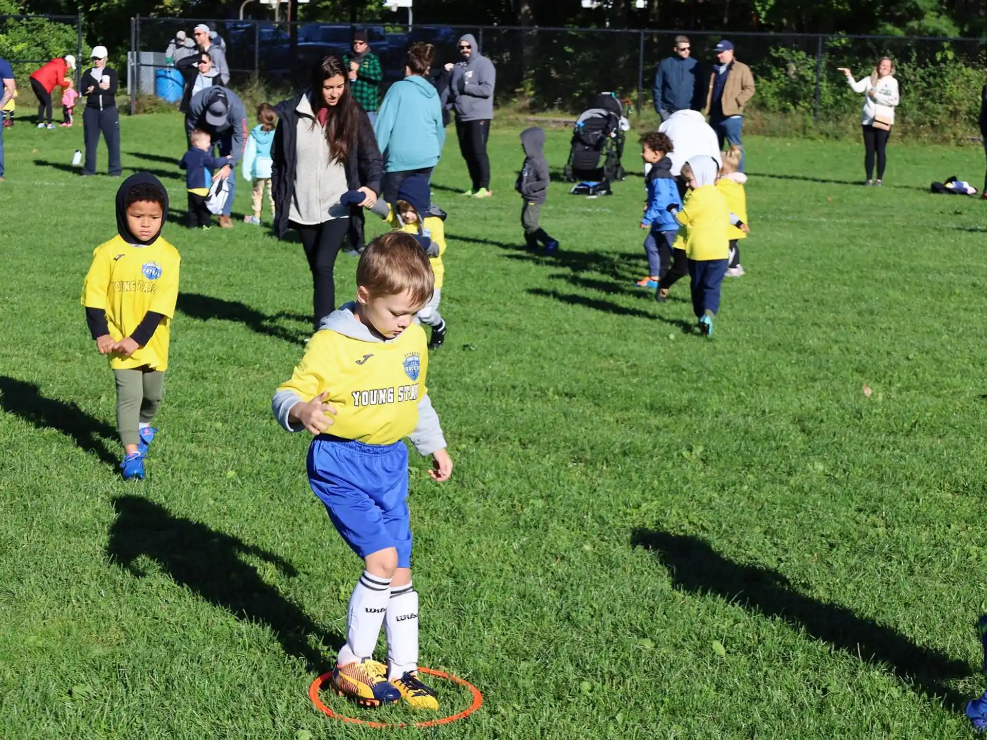 kids playing football on a field