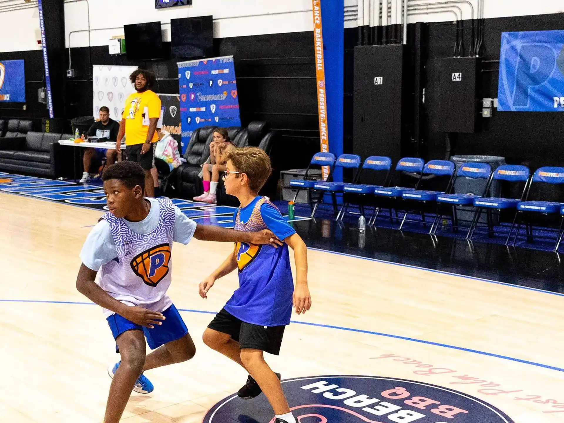 a couple of boys playing basketball