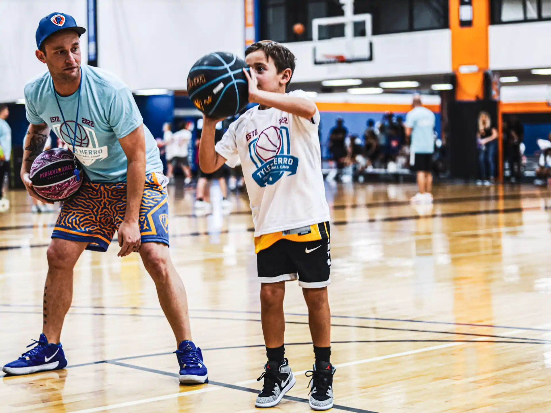 a couple of men playing basketball