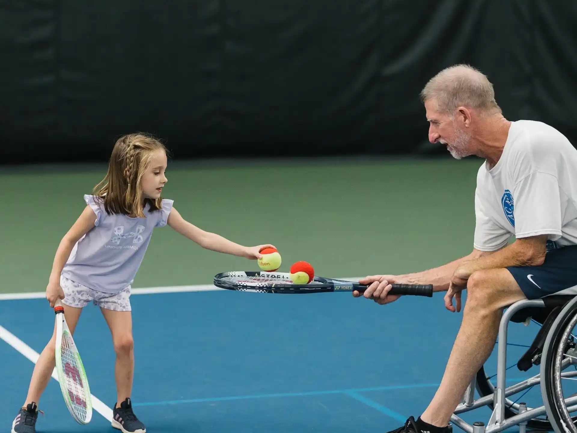 a man and a woman playing tennis