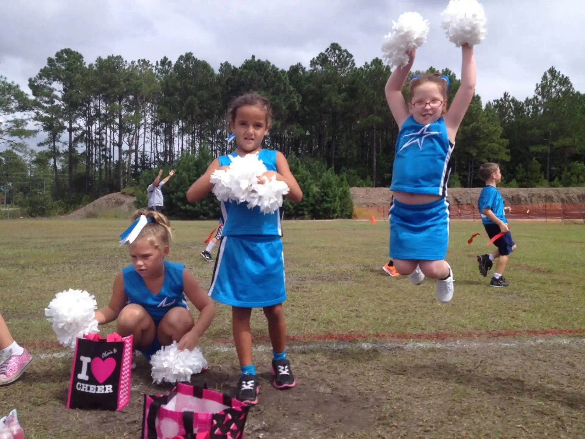 a group of girls in blue uniforms
