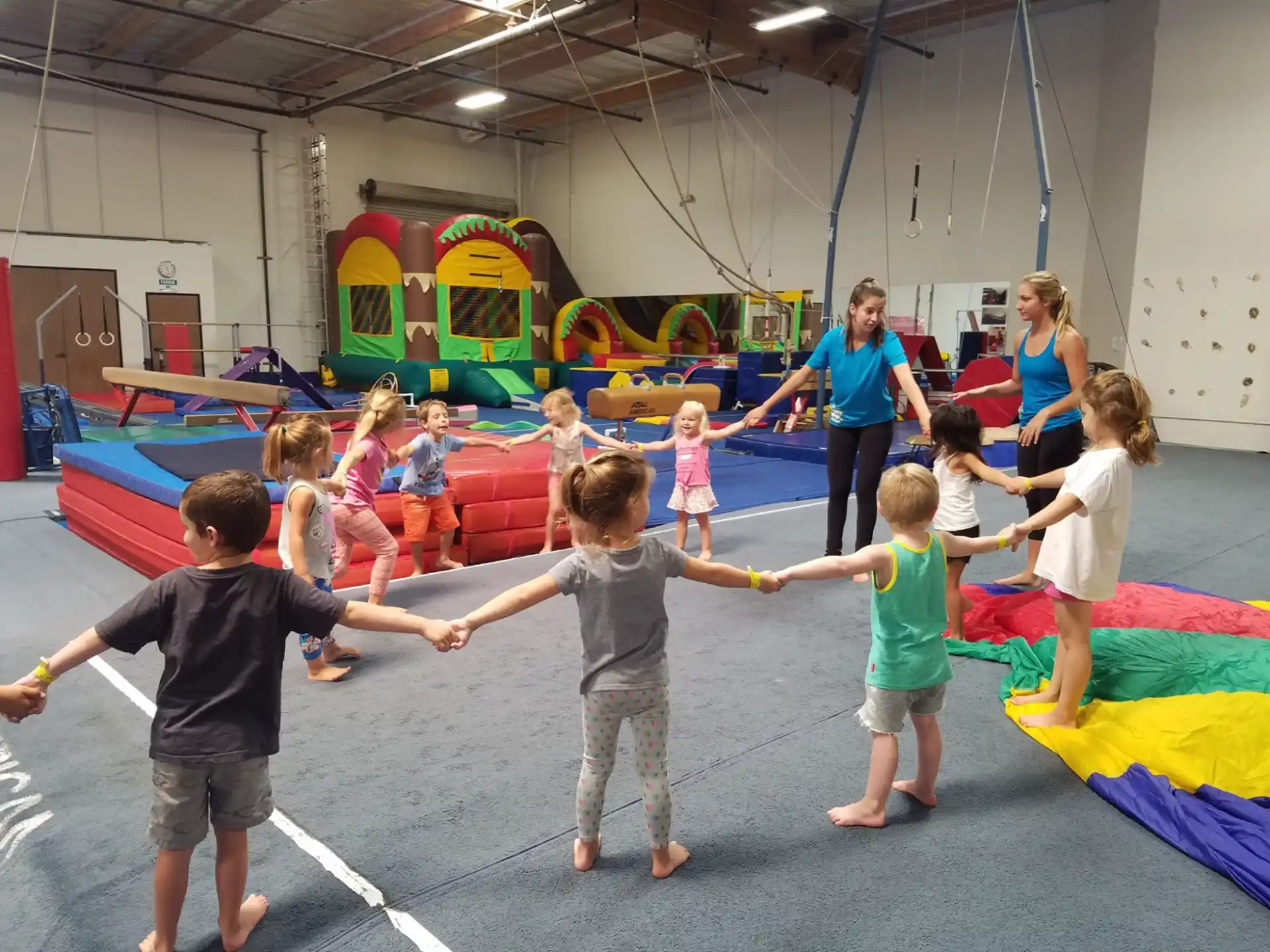a group of children playing in a gym